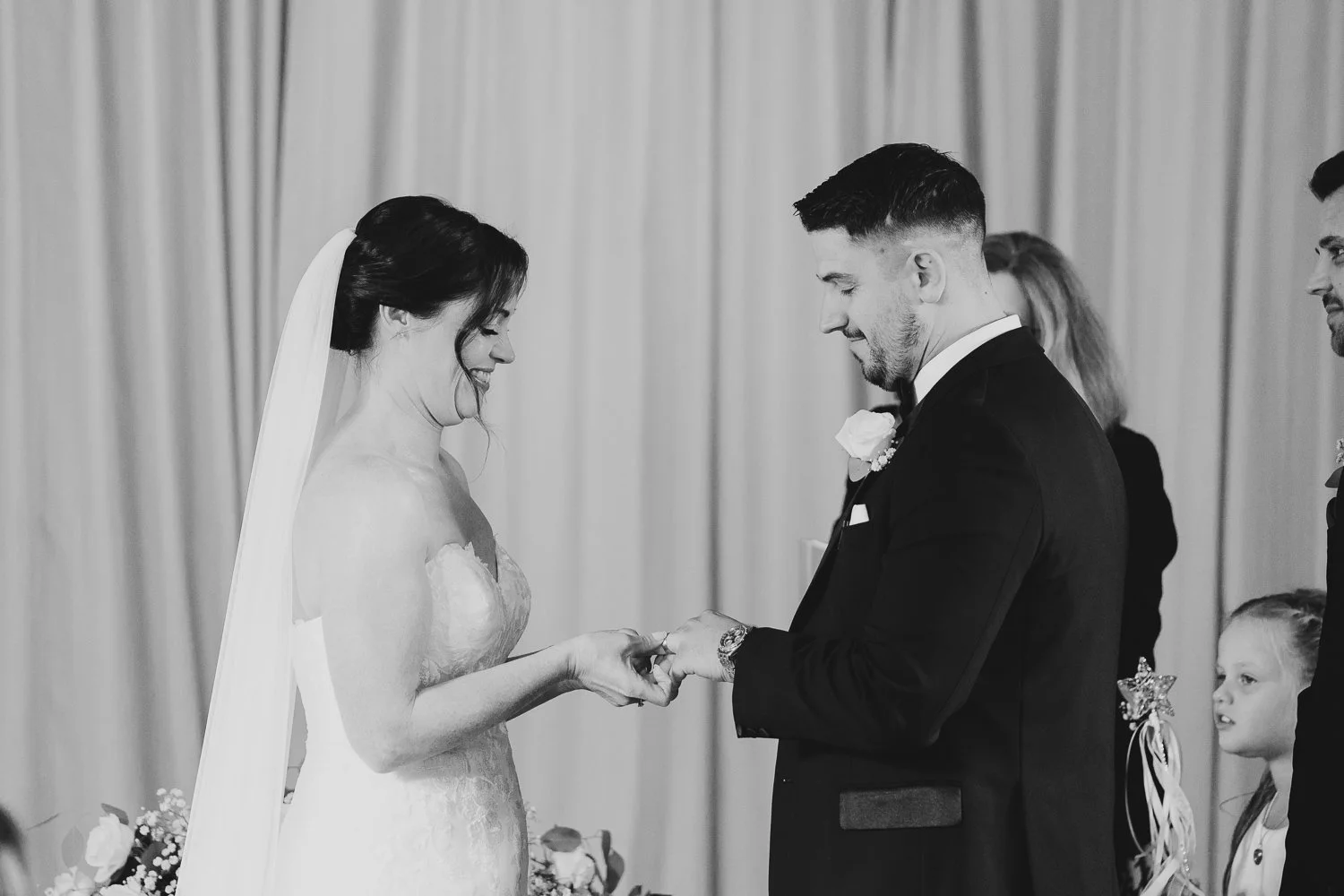 clock-barn-berkshire-wedding-bride-and-groom-exchanging-rings.jpg