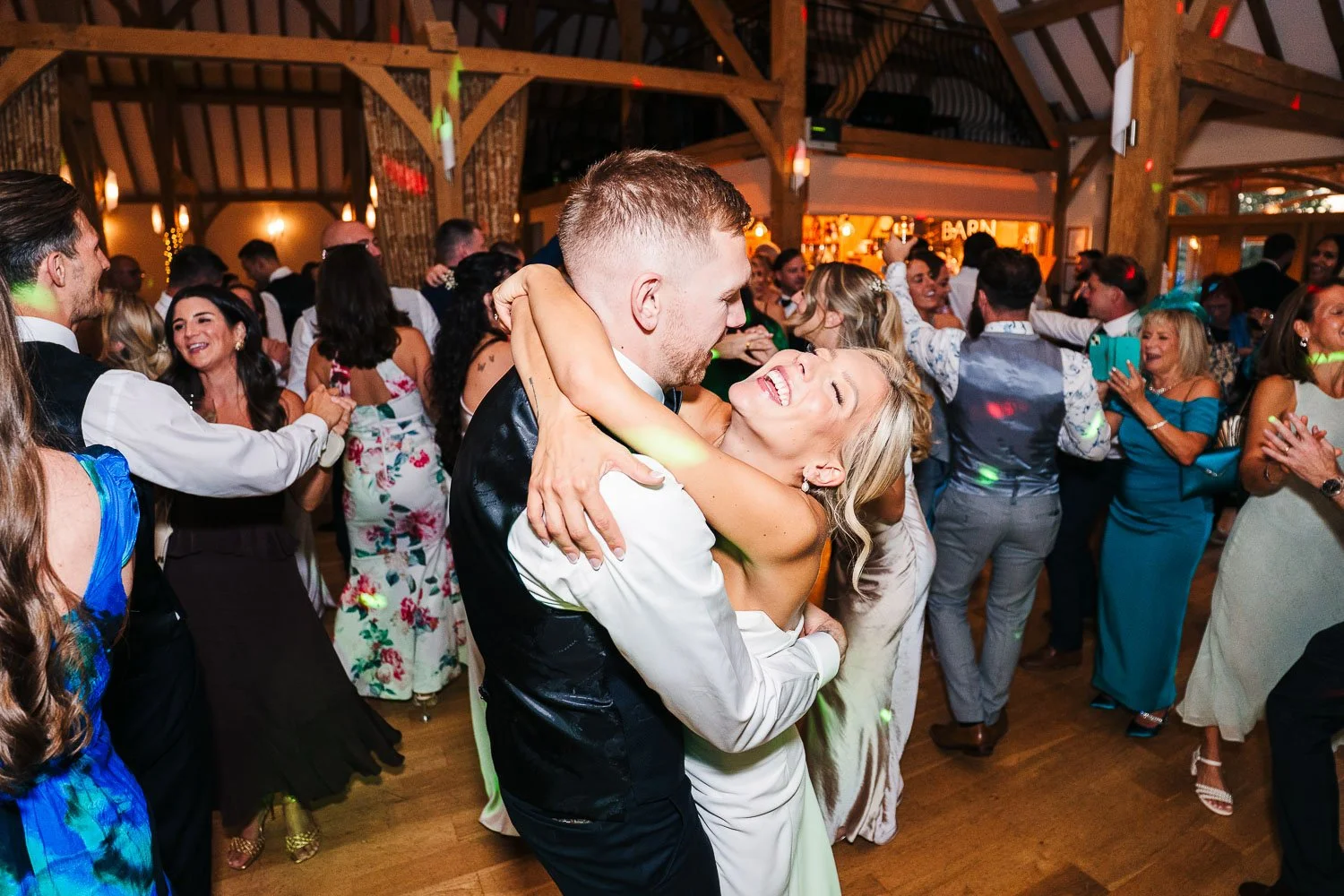 rivervale-barn-wedding-bride-and-groom-dancing-with-glee.jpg