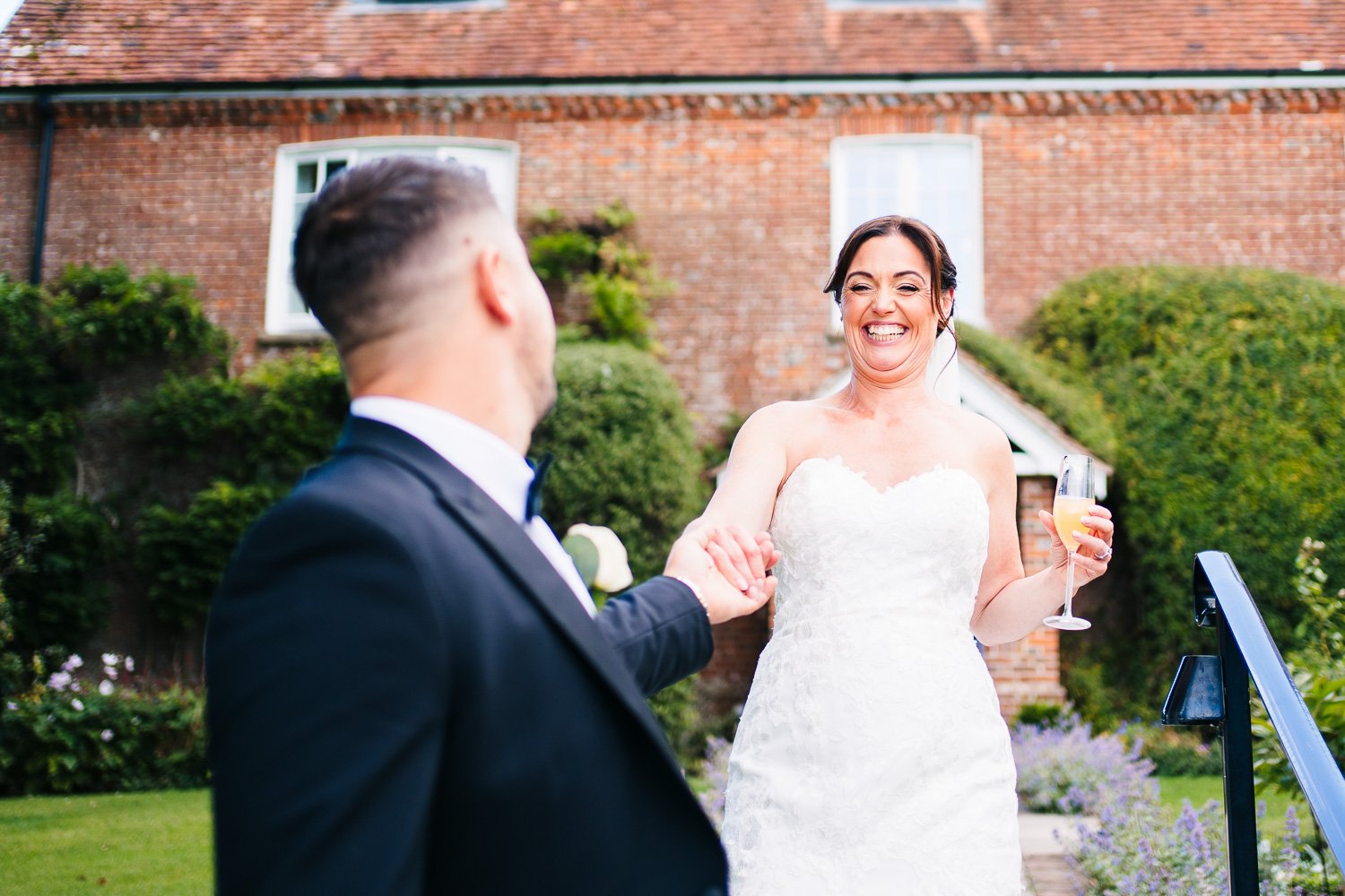 clock-barn-wedding-bride-laughing-candid.jpg