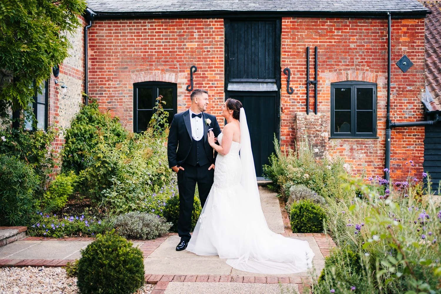clock-barn-berkshire-wedding-couple-enjoying-each-others-company.jpg