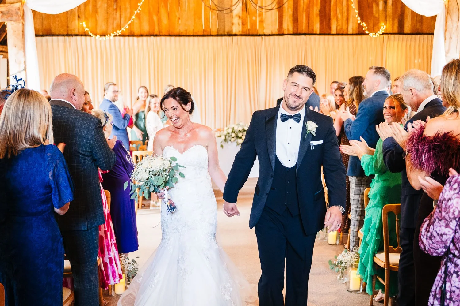 clock-barn-berkshire-wedding-bride-and-groom-leaving-the-ceremony.jpg