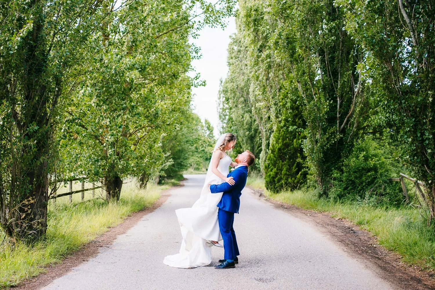 lillibrooke-manor-wedding-groom-lifting-happy-bride-into-the-air.jpg