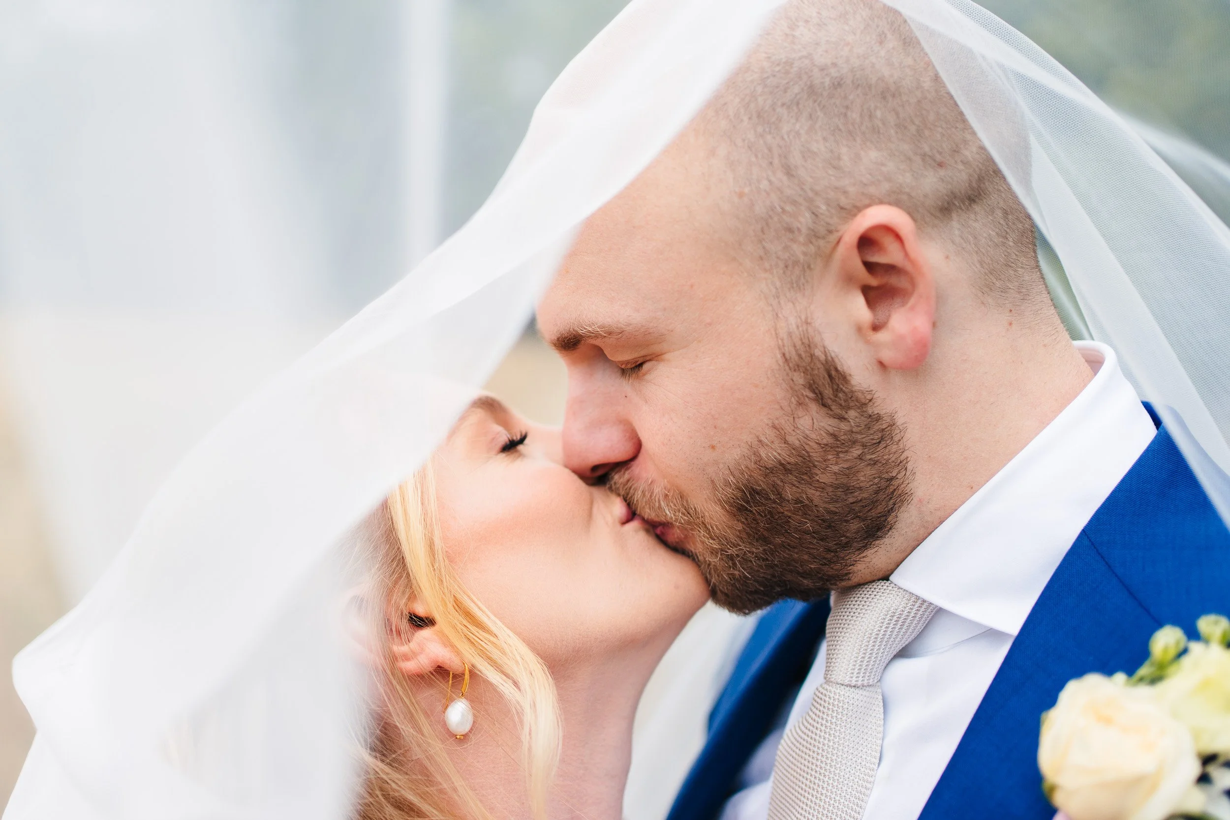 lillibrooke-wedding-bride-kissing-groom.jpg