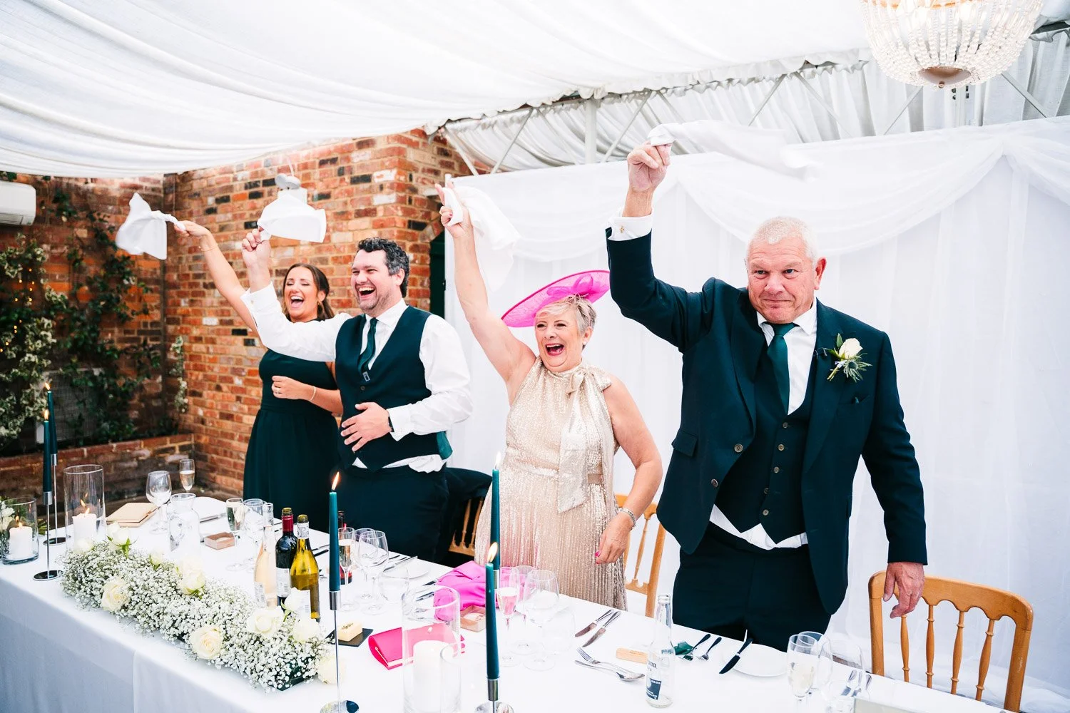 northbrook-park-couple-entrance-candid-of-top-table.jpg