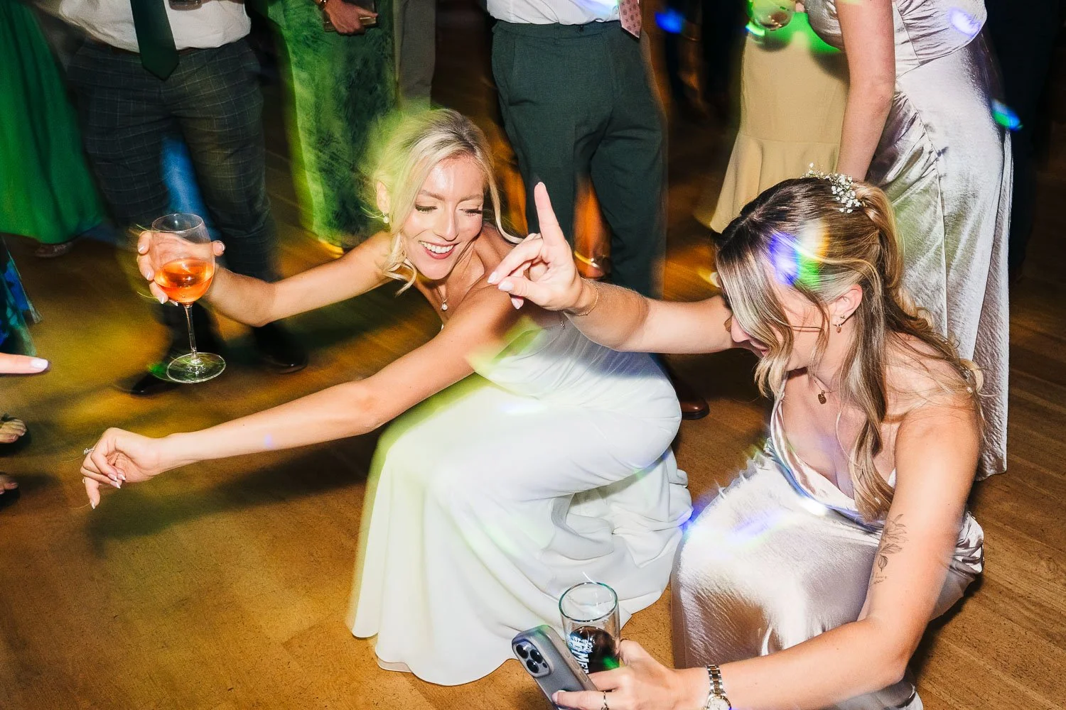 rivervale-barn-wedding-bride-and-bridesmaid-boogying.jpg