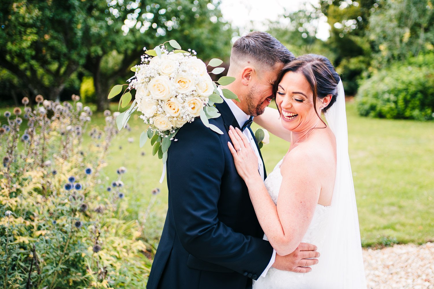 clock-barn-wedding-couple-portrait-laughing.jpg