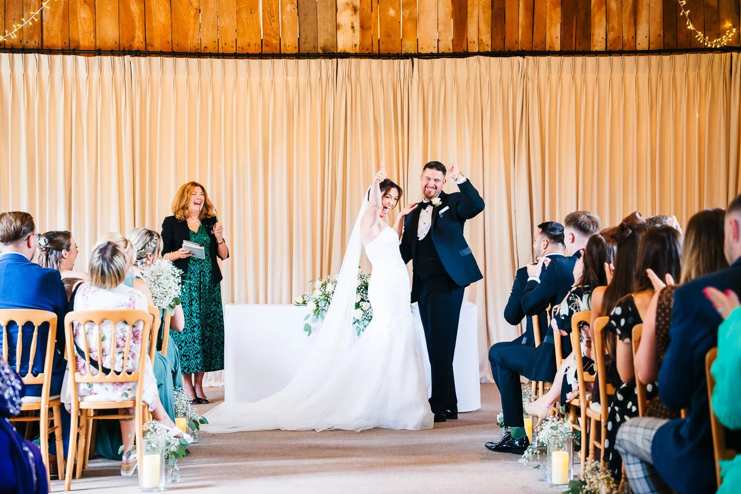 clock-barn-berkshire-wedding-bride-and-groom-celebrating-marriage.jpg