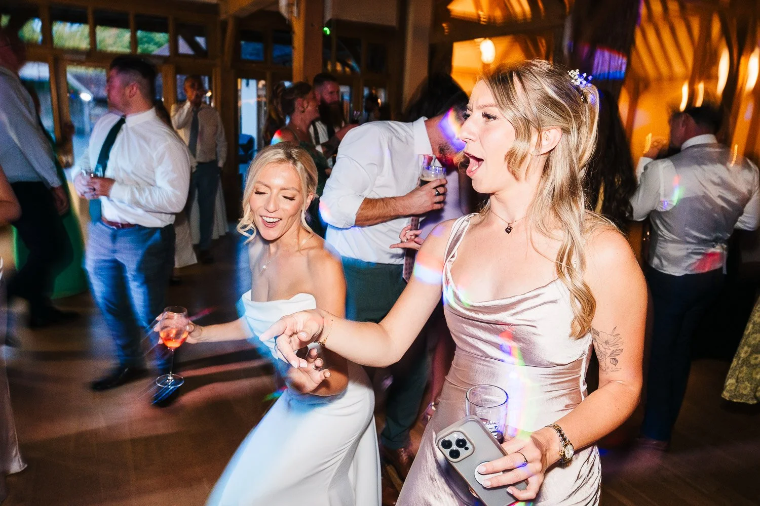 rivervale-barn-wedding-bride-and-bridesmaid-dancing.jpg
