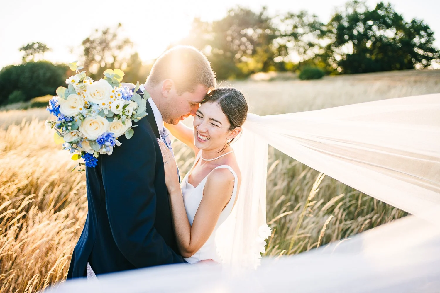 berkshire-wedding-bride-and-groom-laughing-at-golden-hour.jpg