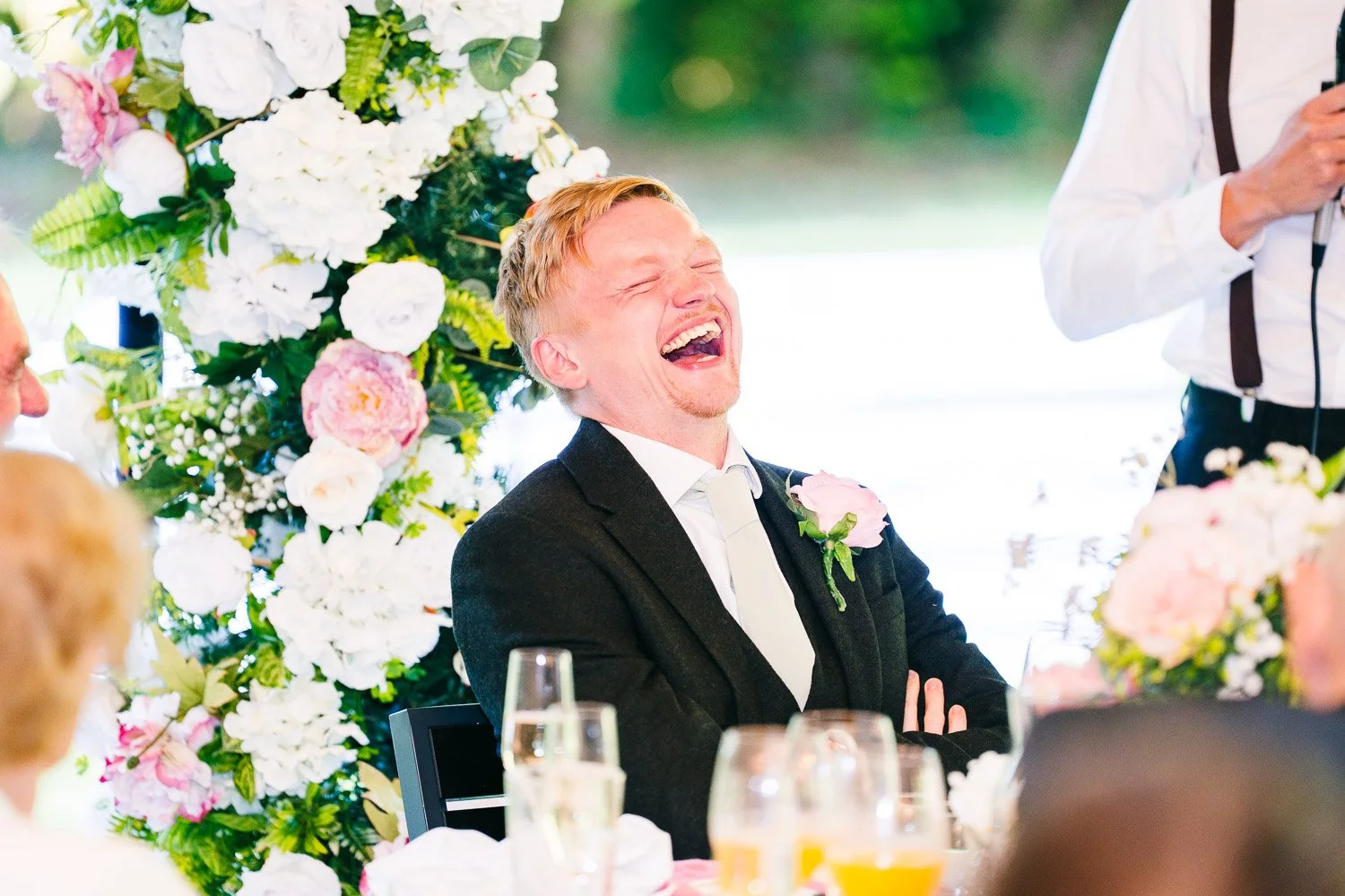 hampshire-wedding-groom-laughing-at-best-man-speech.jpg