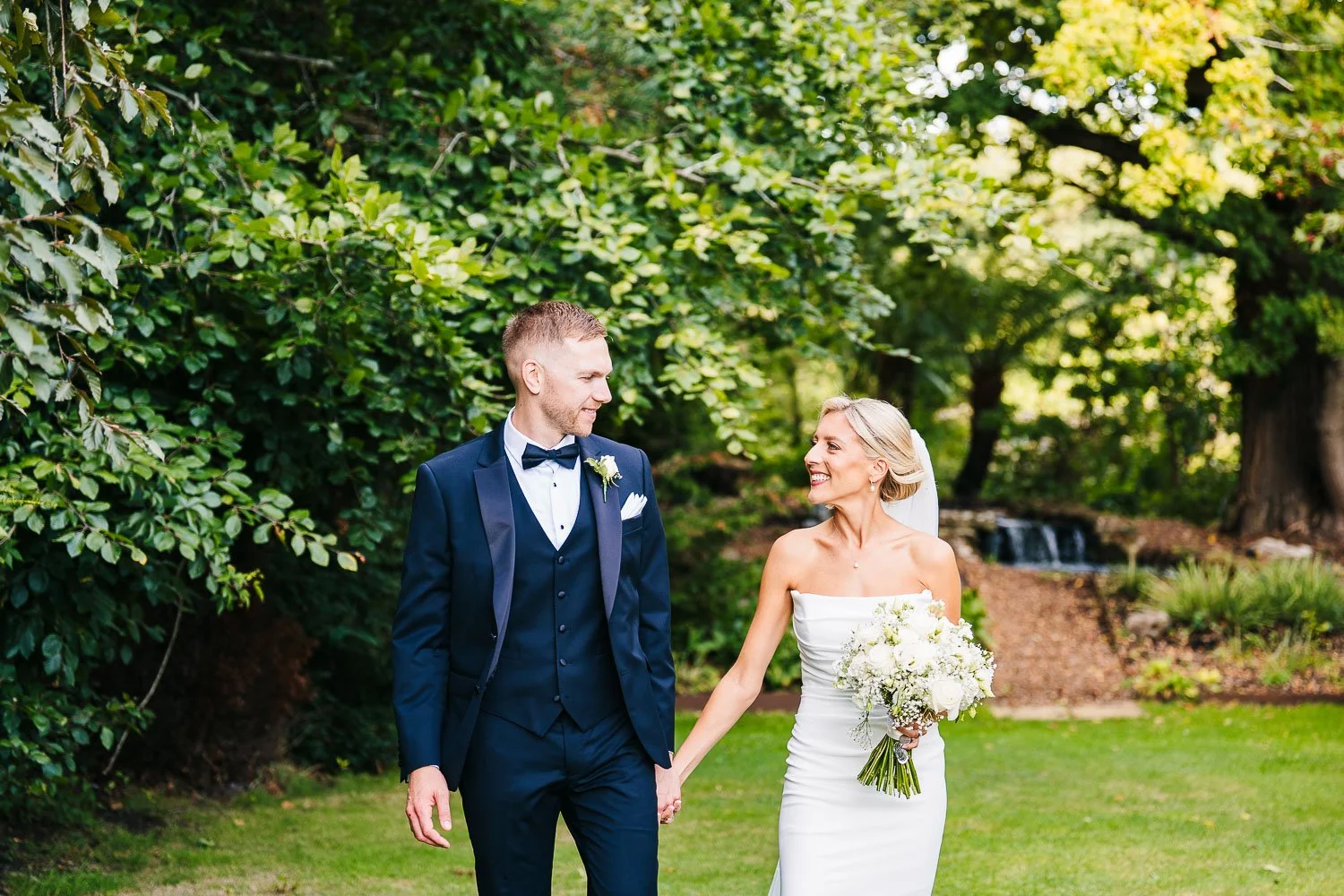 rivervale-barn-berkshire-wedding-couple-walking-and-smiling.jpg
