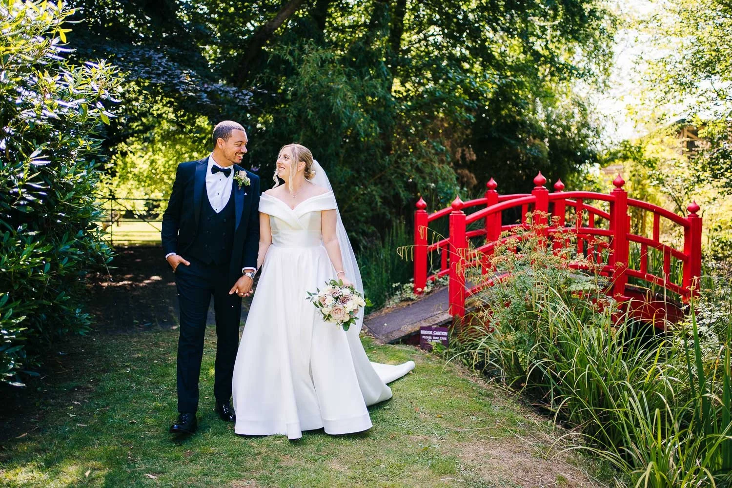 rivervale-barn-wedding-bride-and-groom-walking.jpg