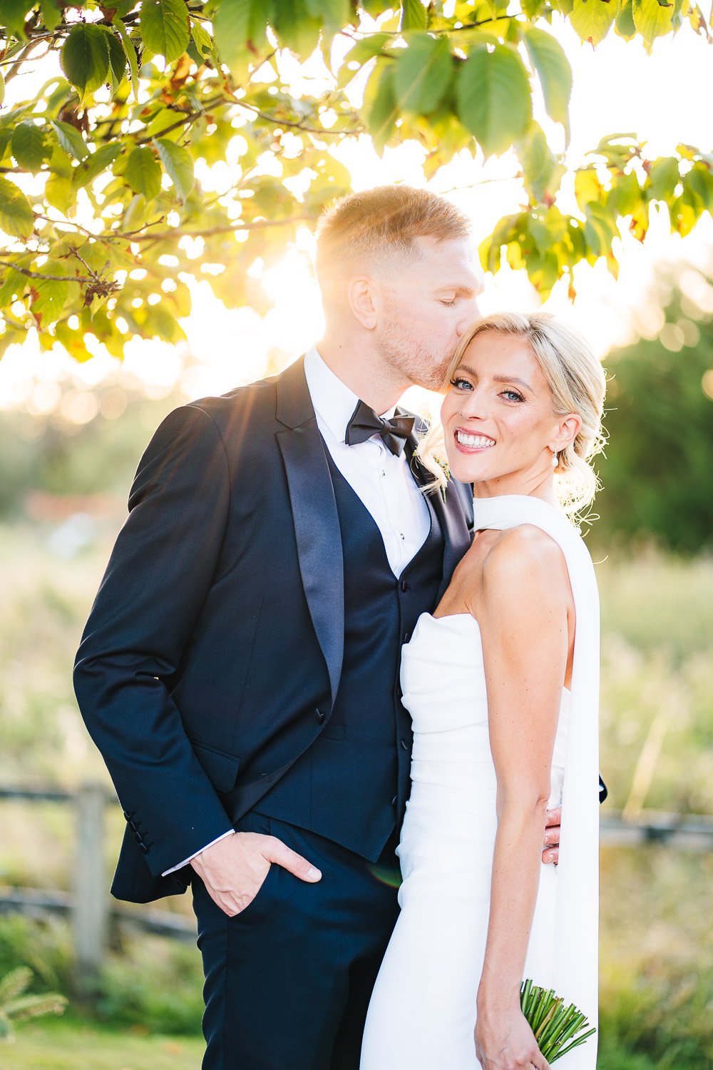 rivervale-barn-wedding-couple-kiss-at-sunset.jpg