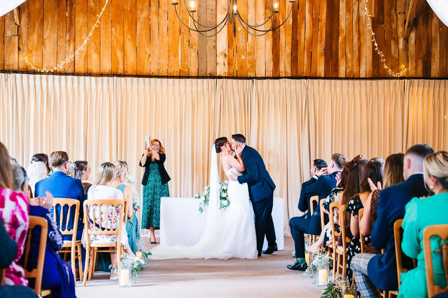 clock-barn-berkshire-wedding-bride-and-groom-first-kiss.jpg