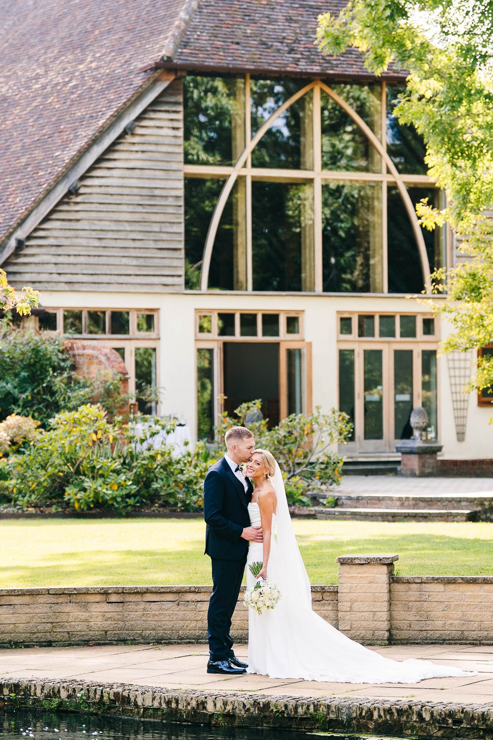 rivervale-barn-berkshire-wedding-couple-portrait-infront-of-venue.jpg