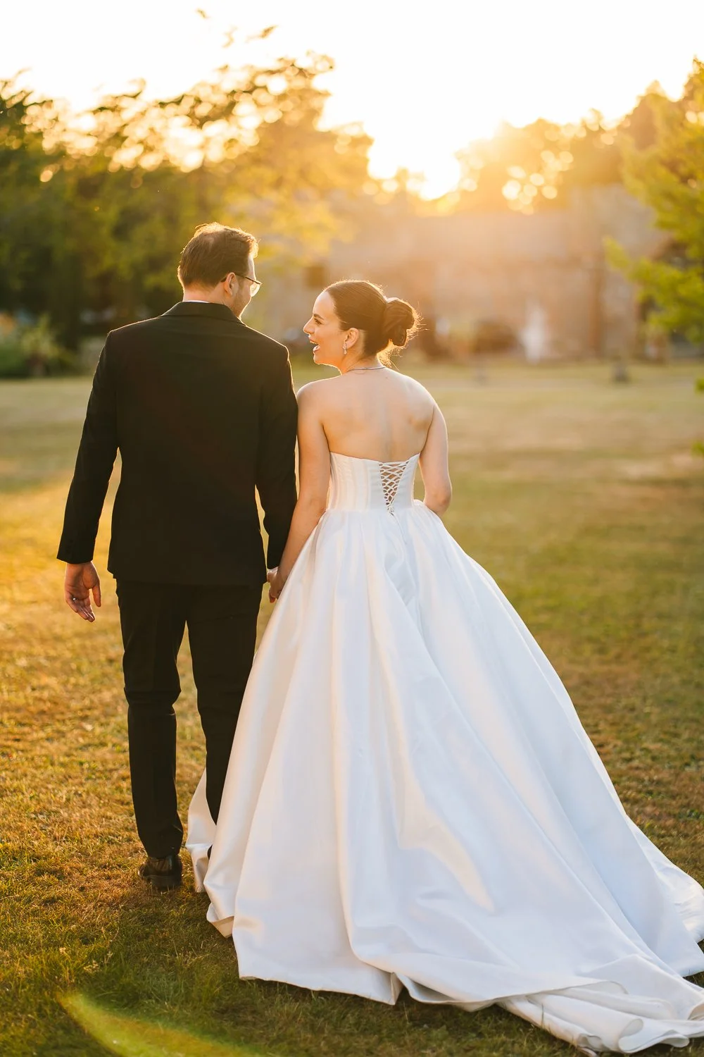 wasing-park-wedding-couple-walking-during-golden-hour.jpg