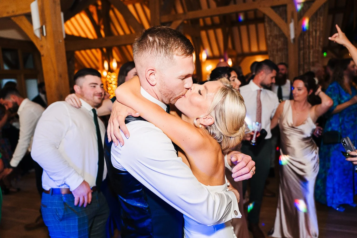 rivervale-barn-wedding-bride-and-groom-dancing-kissing-on-the-dance-floor.jpg