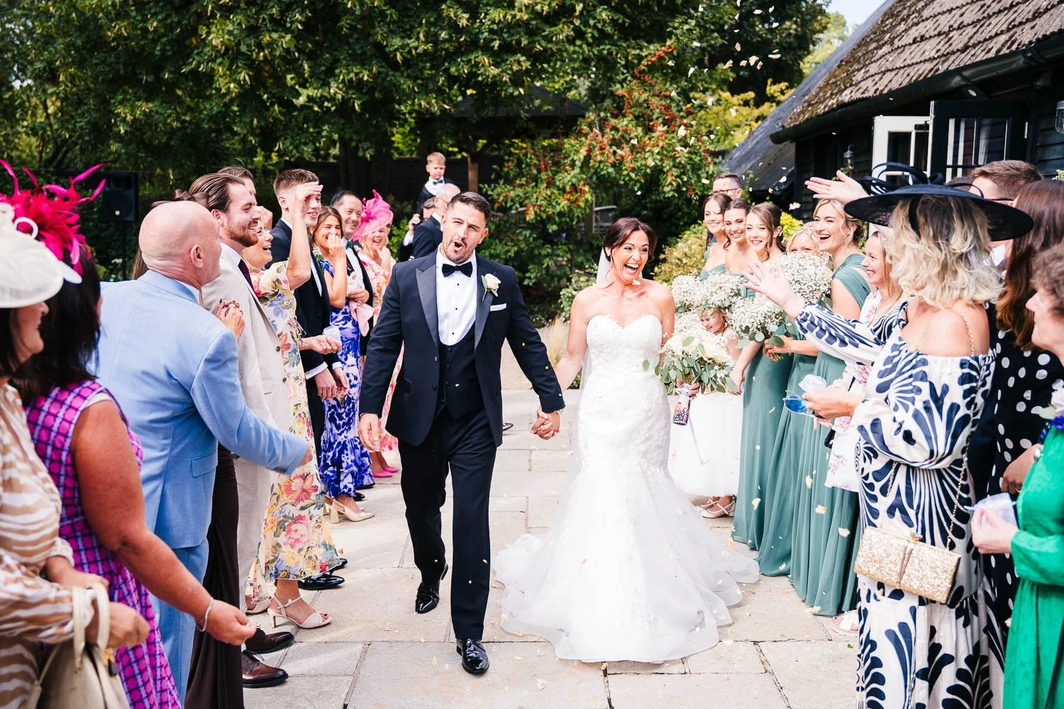clock-barn-berkshire-wedding-confetti-tunnel.jpg