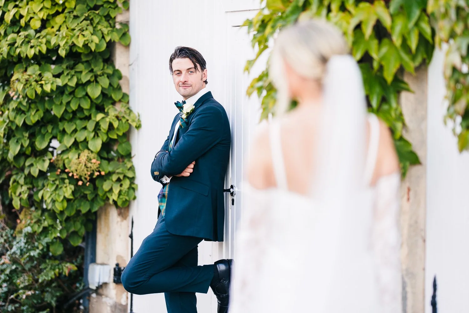 northbrook-park-groom-checking-out-bride.jpg