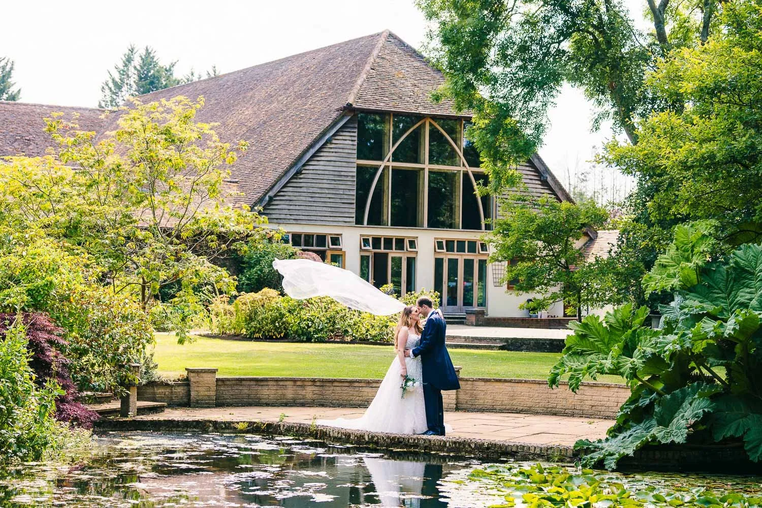 rivervale-barn-wedding-veil-blowing-in-the-wind.jpg