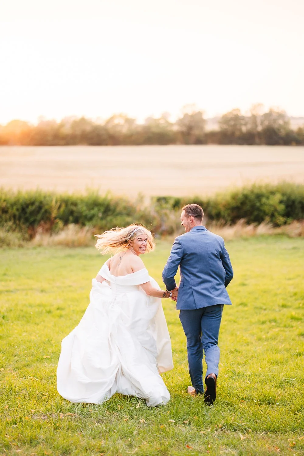 buckinghamshire-wedding-bride-and-groom-run-into-the-sunset.jpg