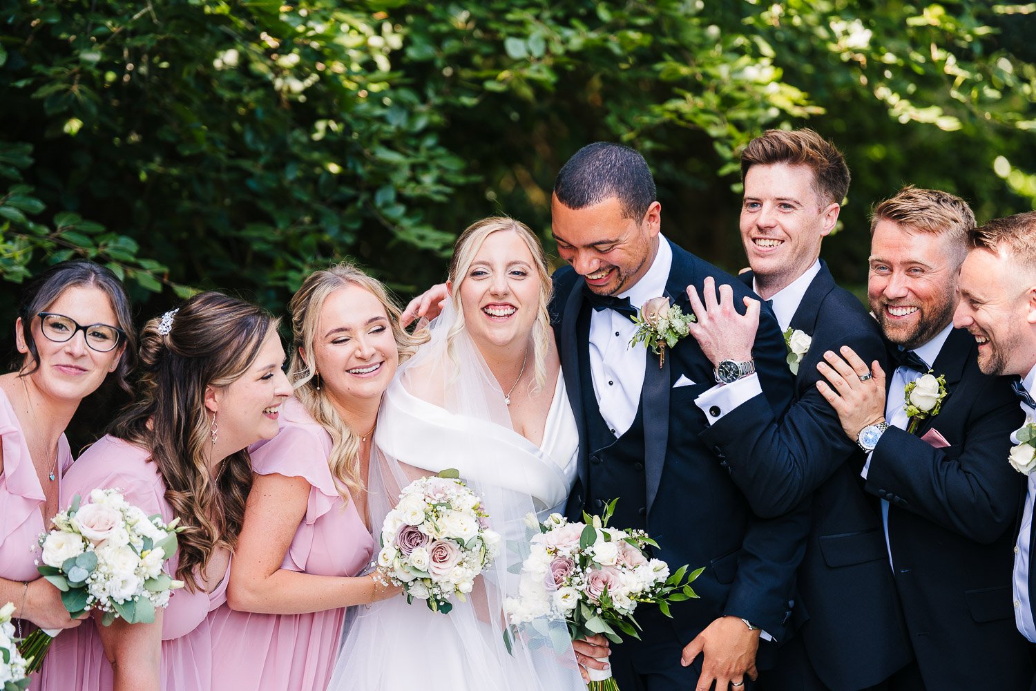 rivervale-barn-wedding-bridal-party-hug.jpg