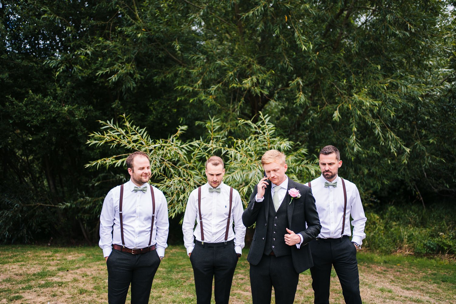 bartons-mill-wedding-groom-candid-with-groomsmen.jpg