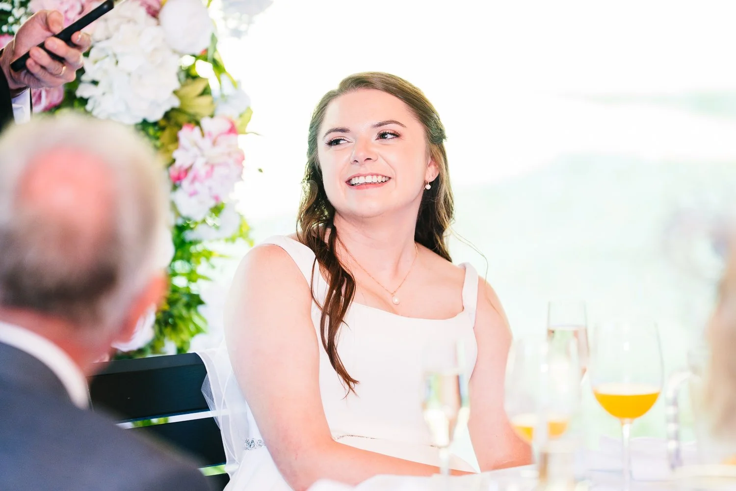 hampshire-wedding-bride-smiling-at-groom-speech.jpg