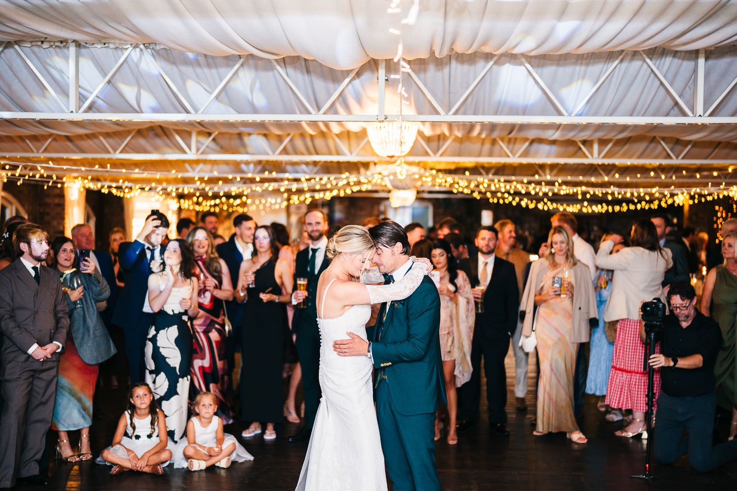 wide-bride-and-groom-first-dance-at-surrey-wedding-venue.jpg