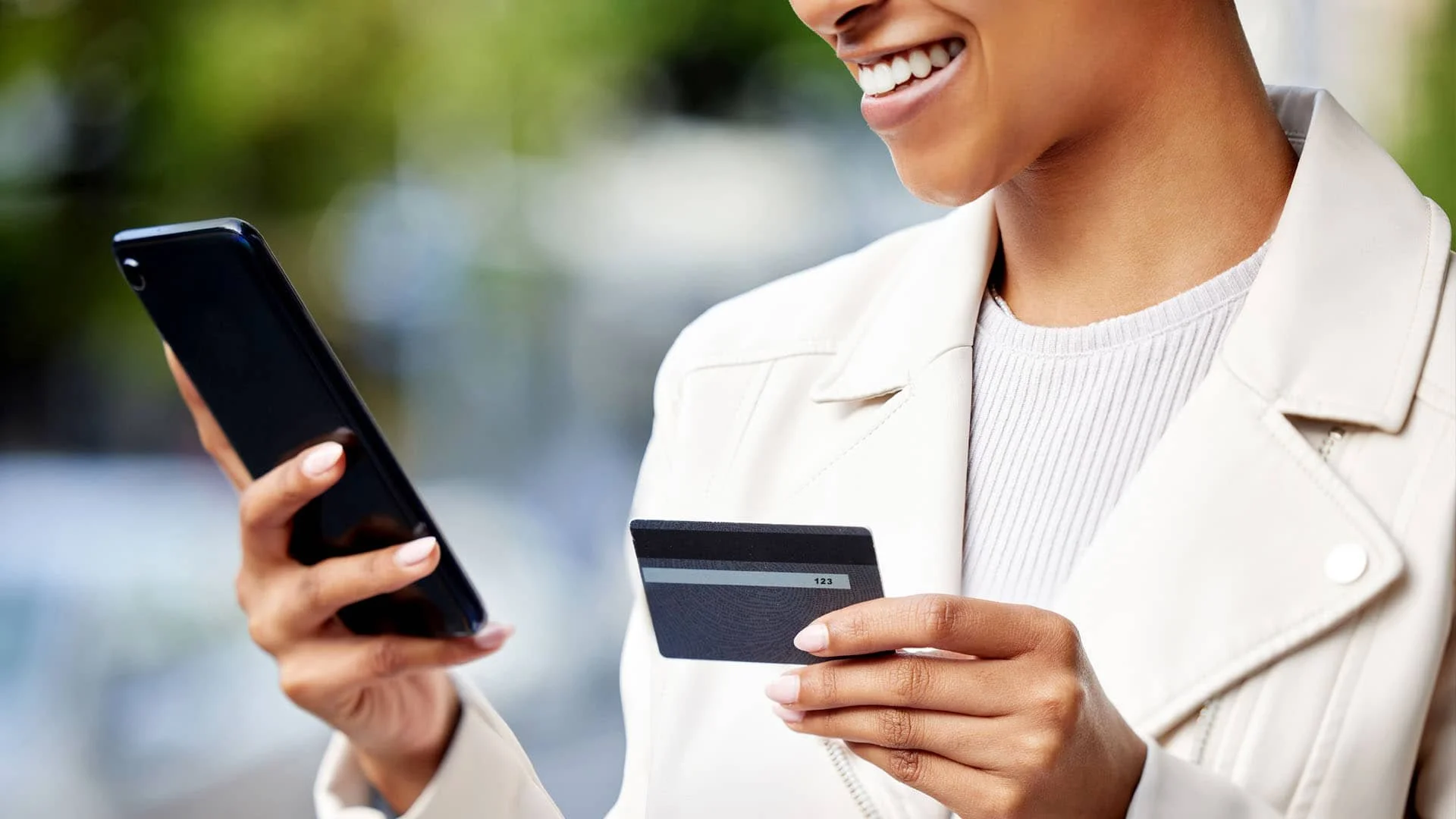 Woman using credit card to buy online