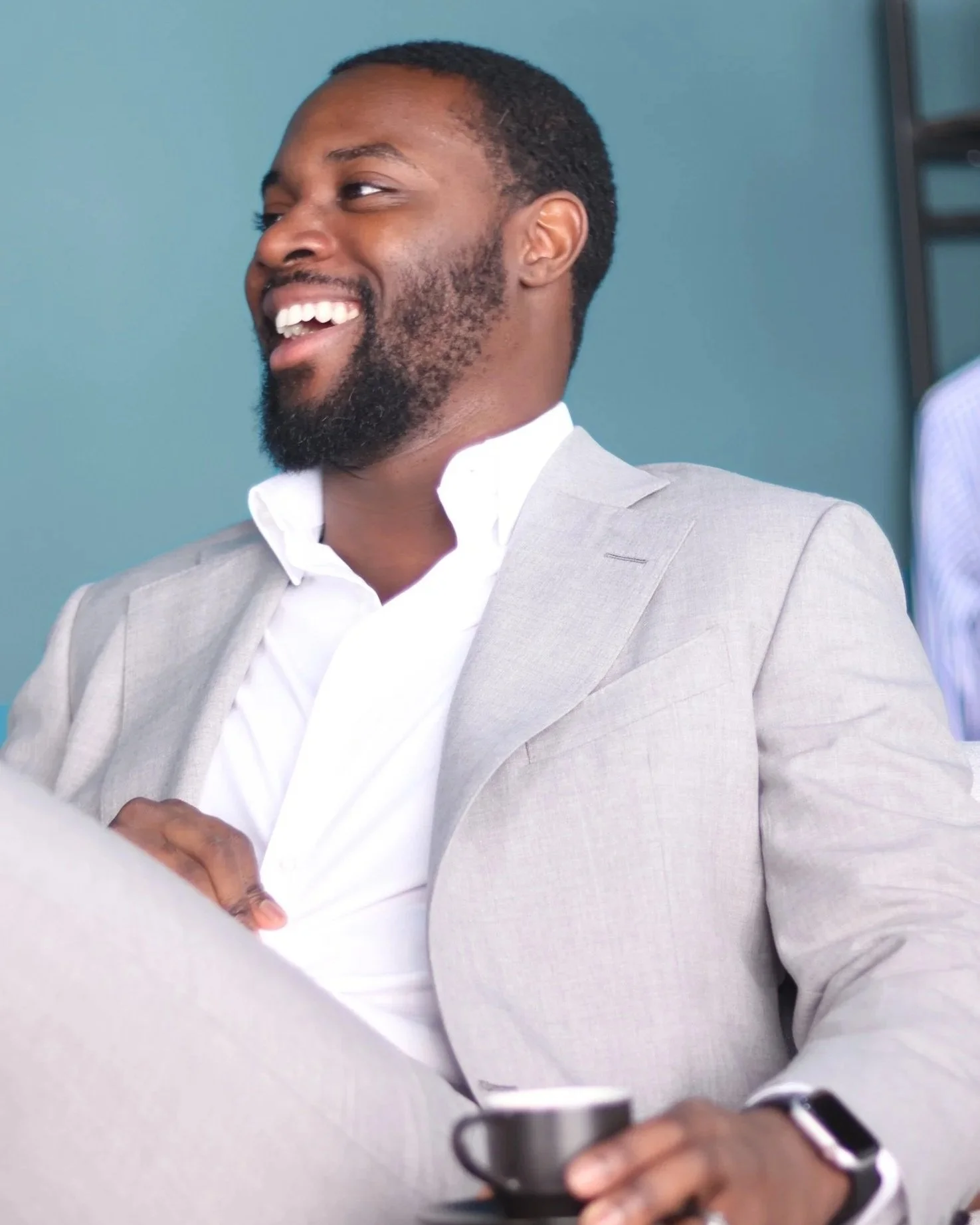 Client wearing a light grey made to measure two piece suit.