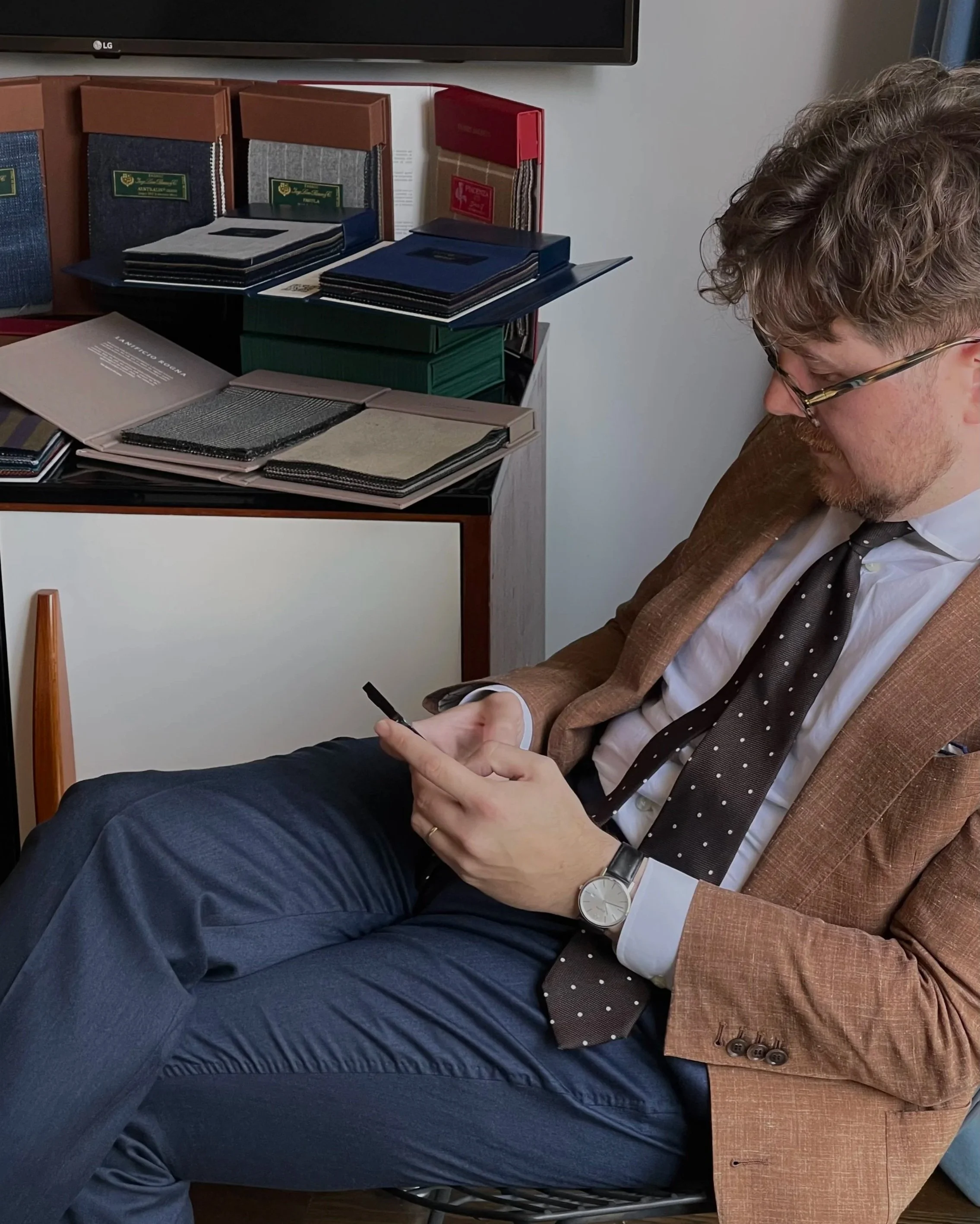 Berez Private Tailor consultation, with fabric bunches