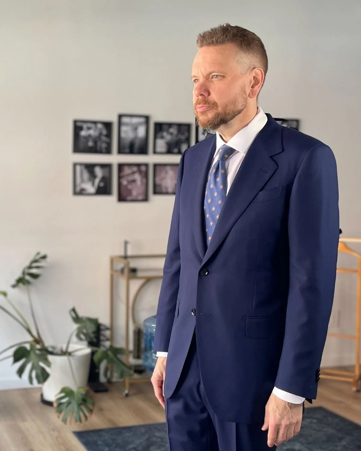 Geoffrey Quart in a navy two-piece suit