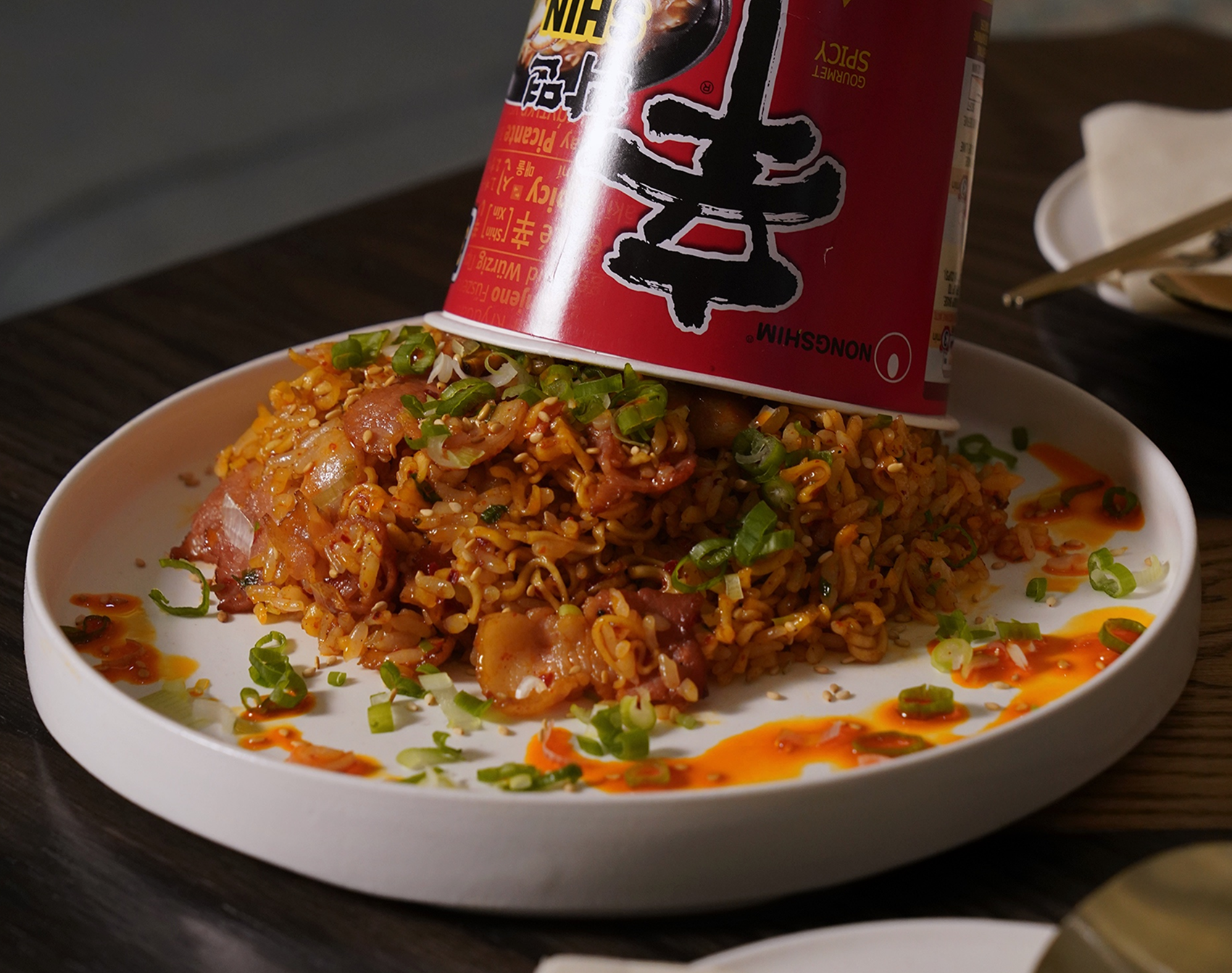 Ramyun Fried Rice served on a white plate with a Shin Ramyun cup.