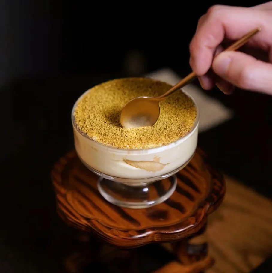 Jeju tangerine tiramisu — layered orange cream, Jeju tangerine, pistachios, ladyfingers, and cacao powder