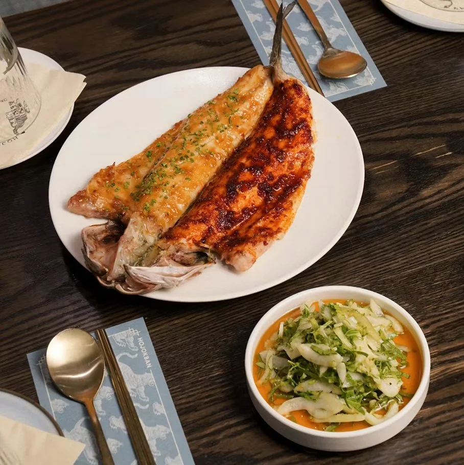 Branzino — whole branzino glazed with doenjang and soy glaze, served with bok choy salad