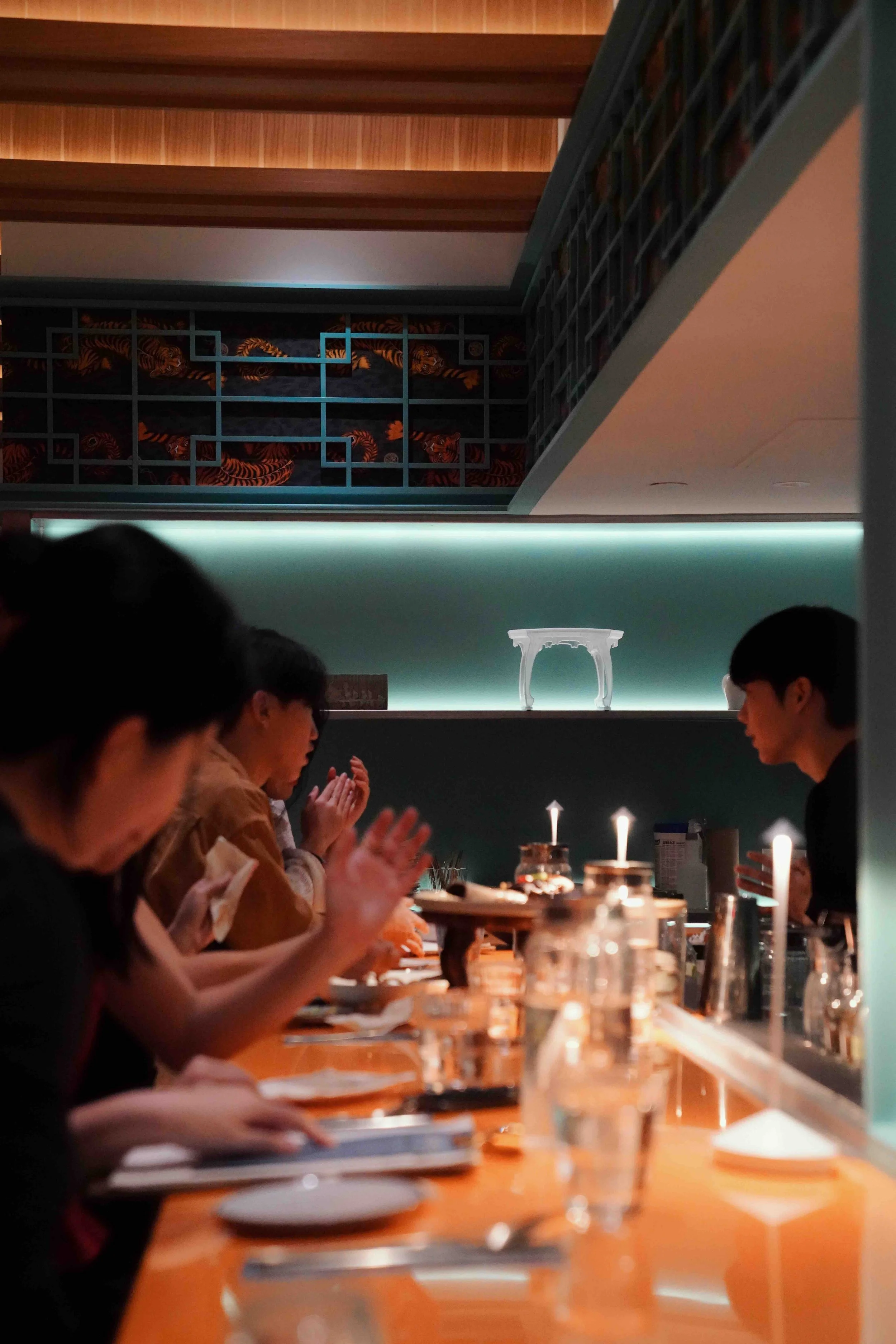 Dining counter at Hojokban New York with guests enjoying a private dinner in a modern Korean interior