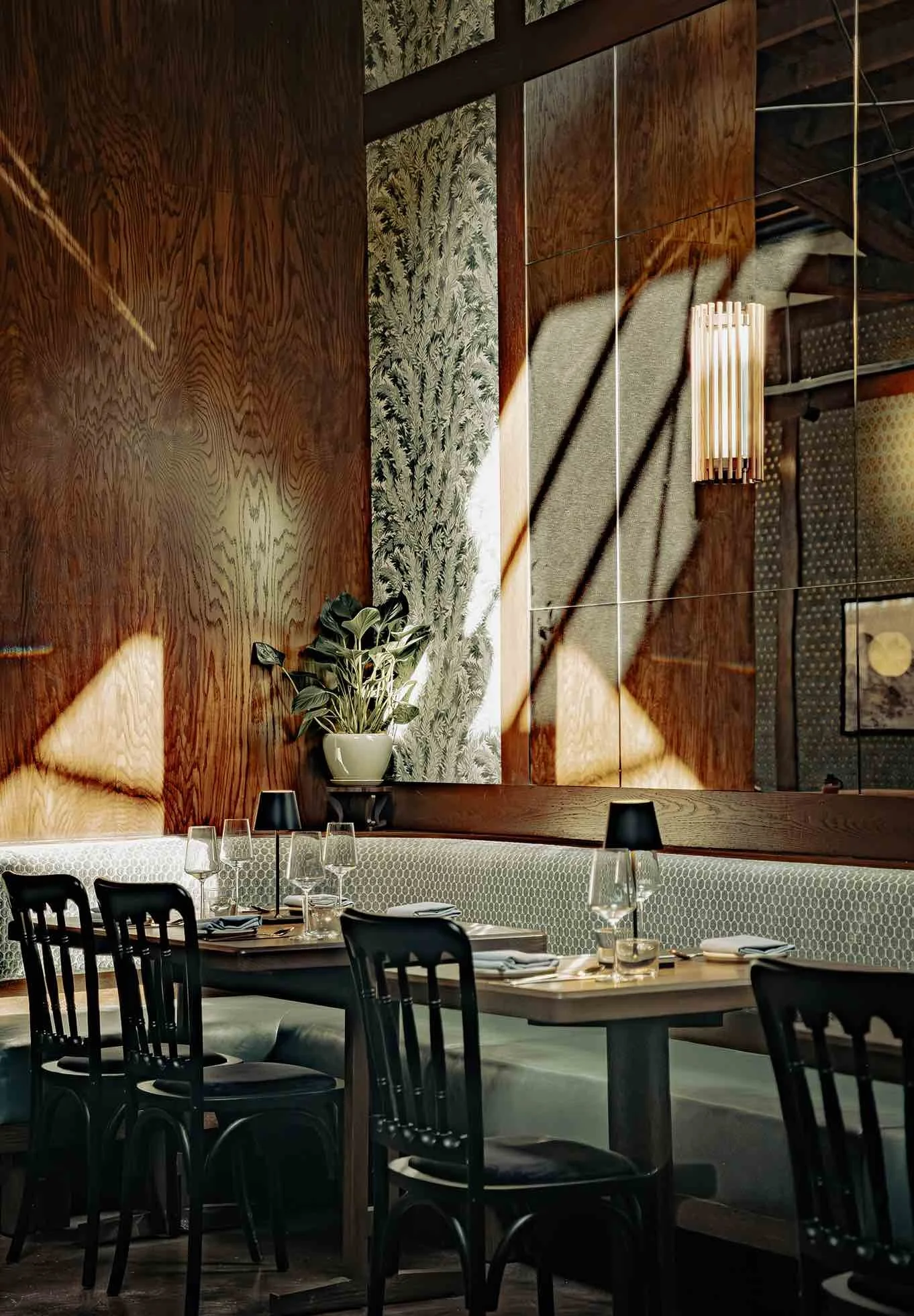 Hojokban Arts District interior dining room with wood paneling natural light and patterned seating