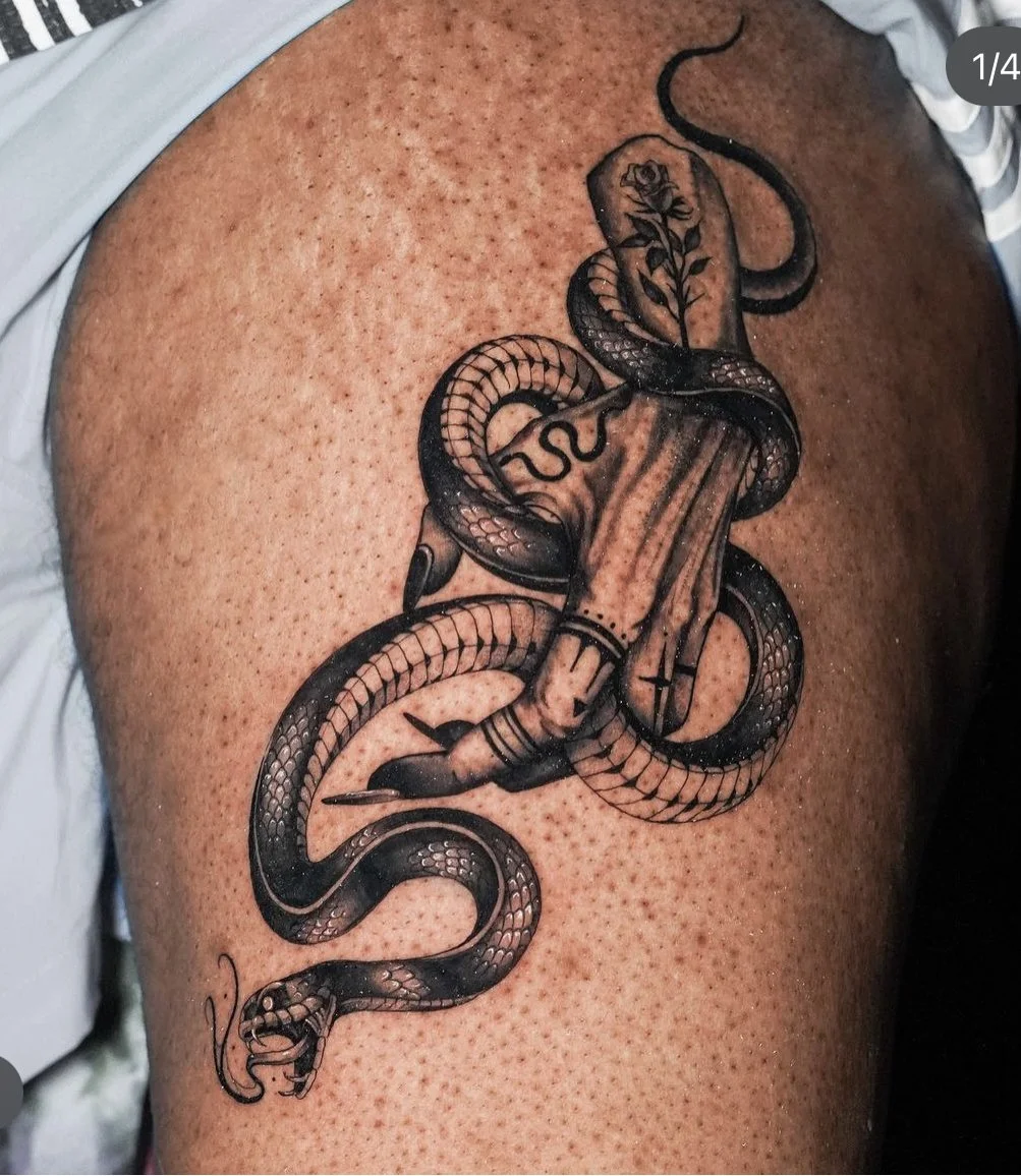 fine line snake and hand tattoo done by queens tattoo artist james jurado