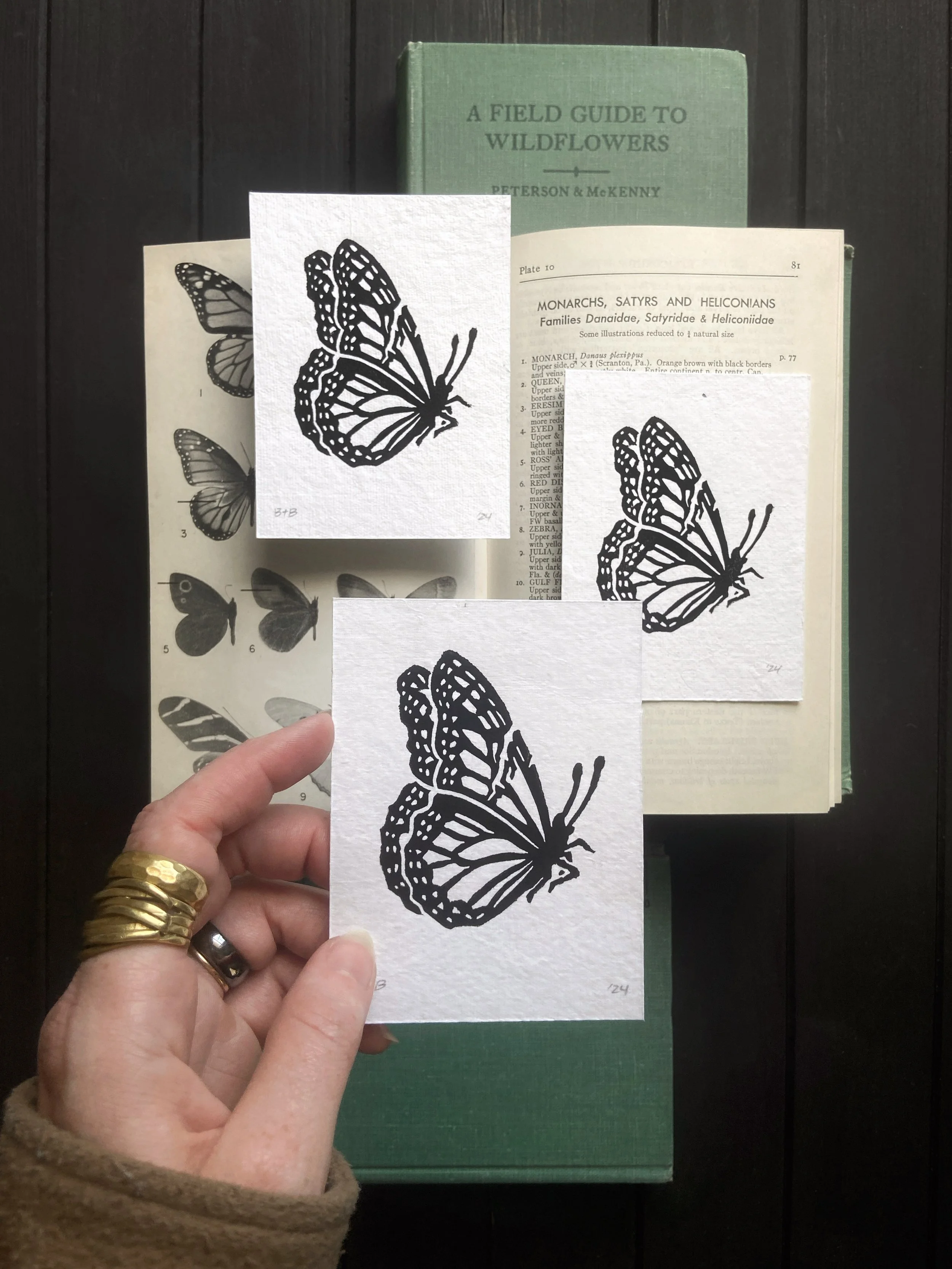 ACS_Fallen Monarch Linocut Tinyprint Flatlay W Hand.JPG
