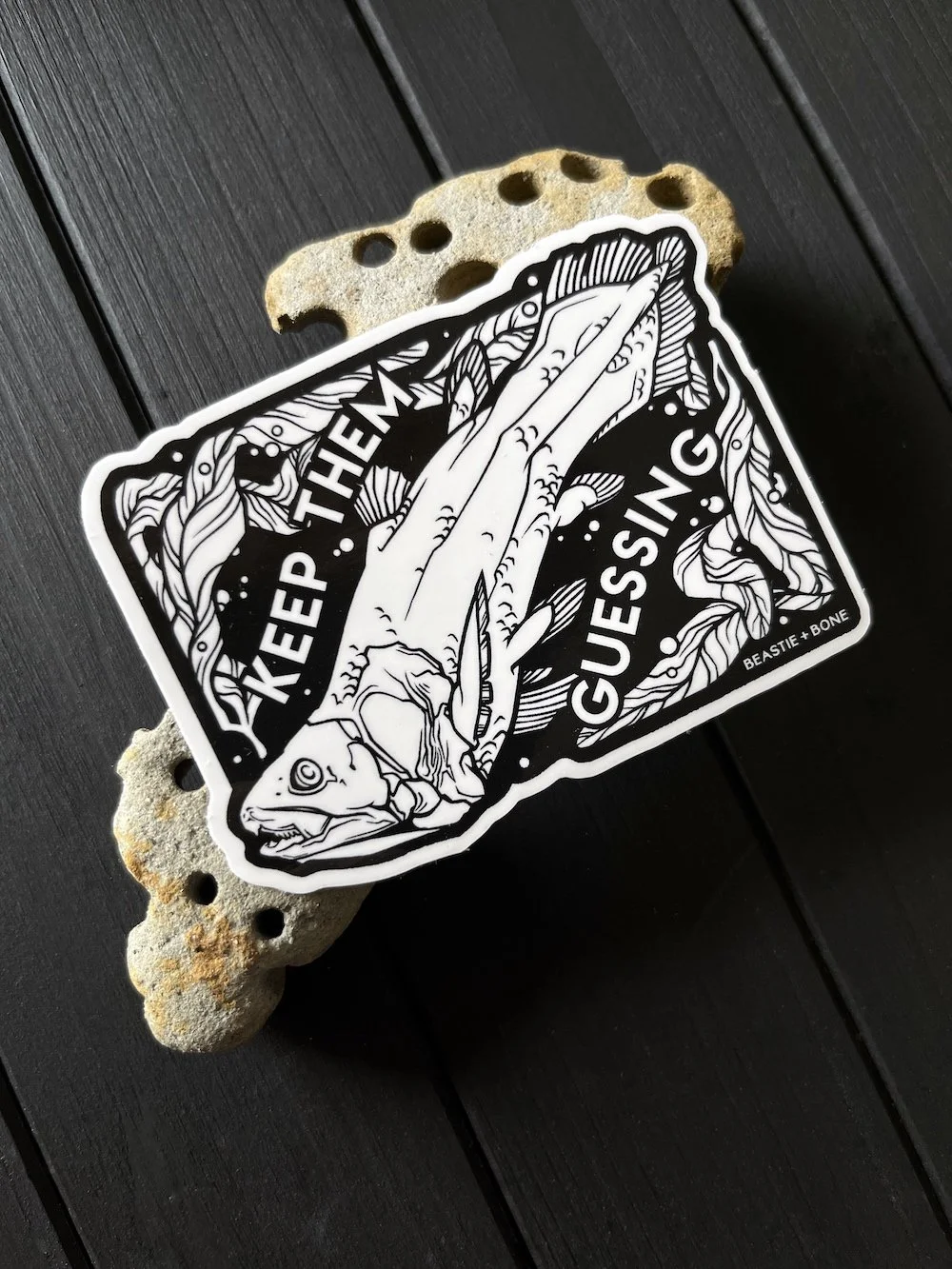 Keep Them Guessing Sticker Flatlay Angled.jpg
