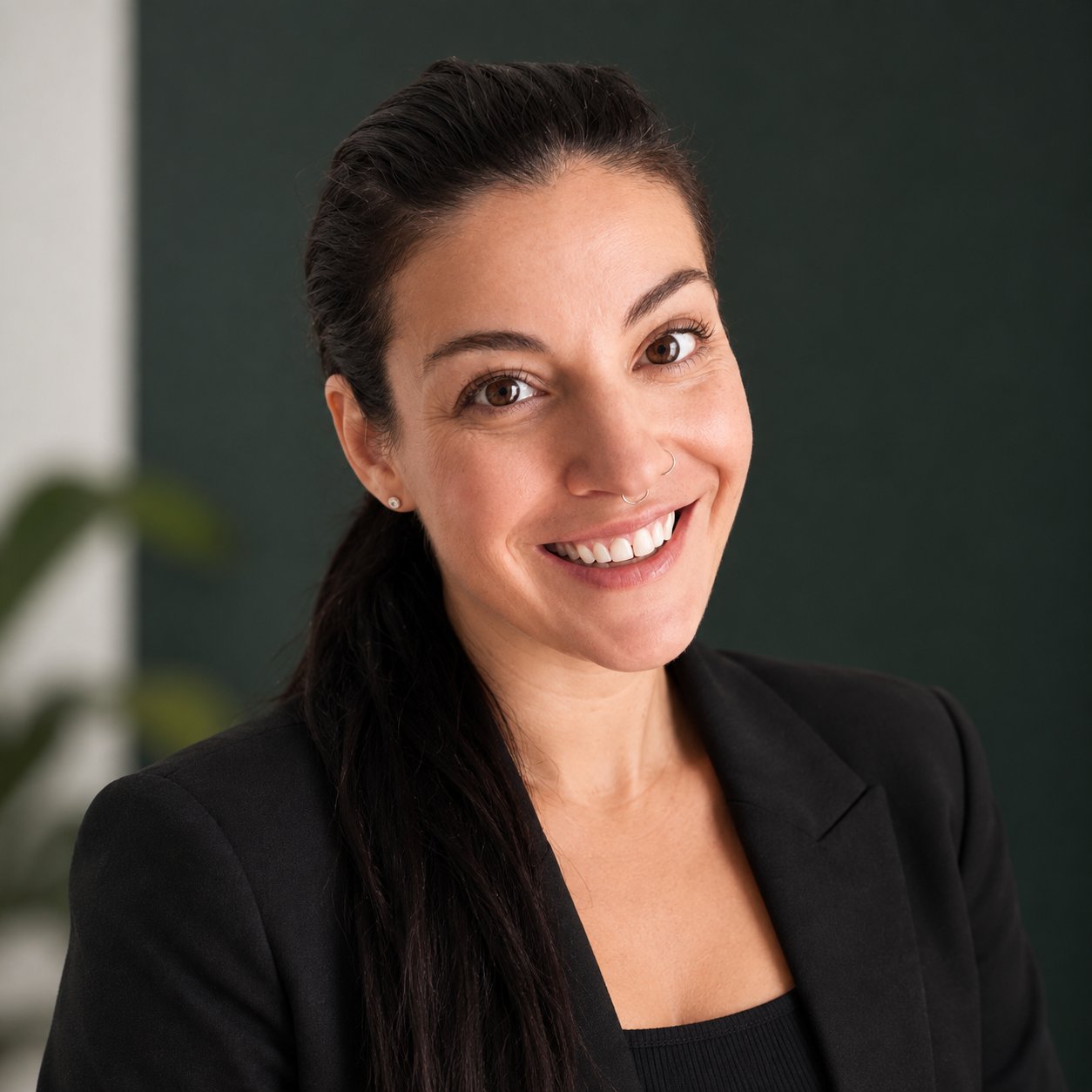 Headshot of a woman in a black suit