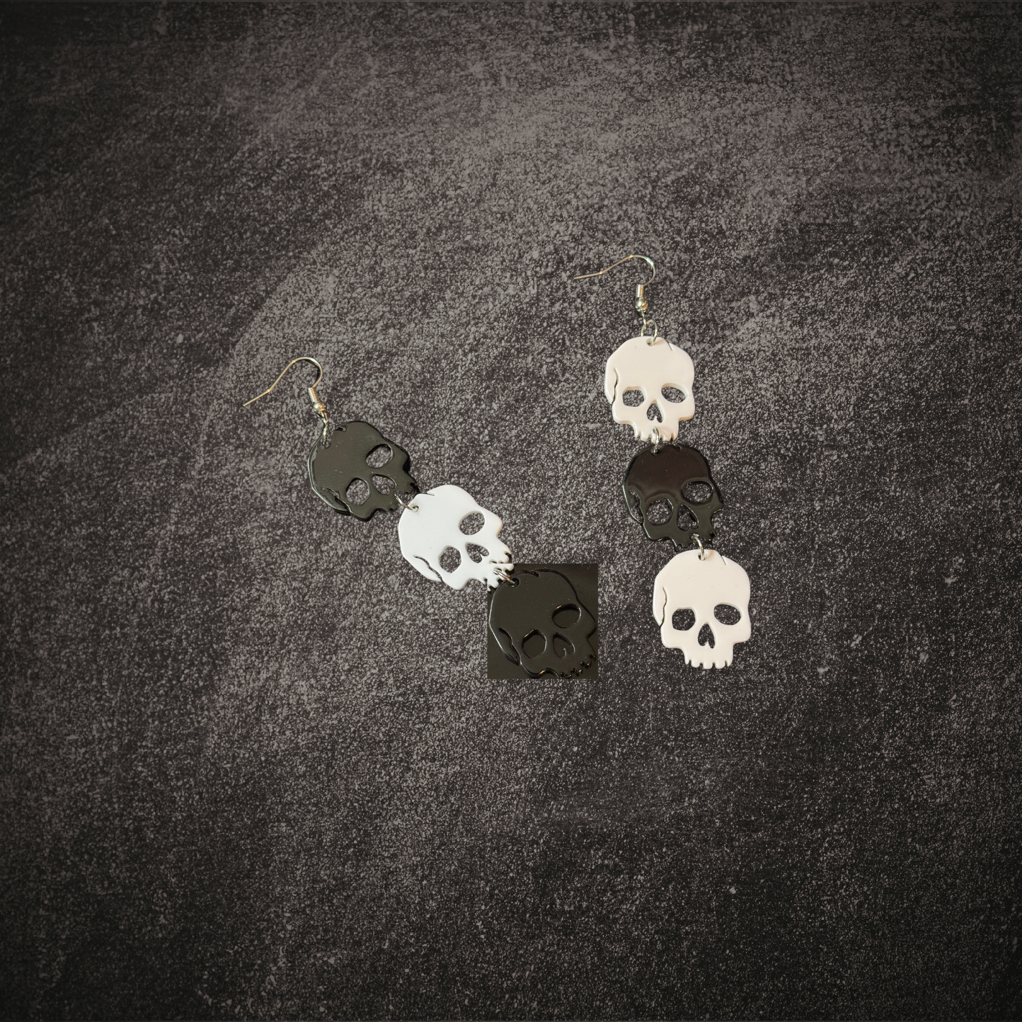 Black and White Skull Dangle Earrings Mockup 1.png