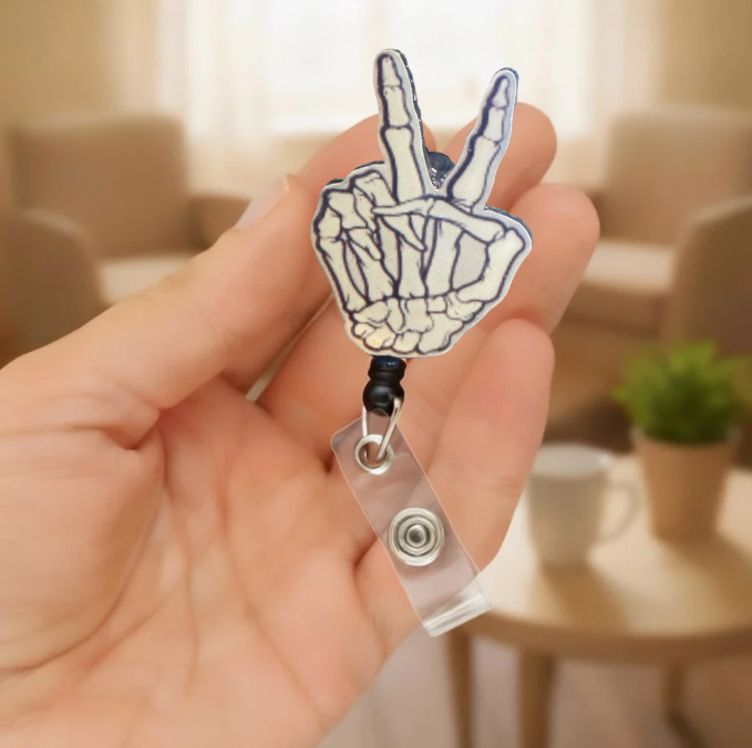 Skeleton Peace Sign Badge Reel Mockup 2.PNG