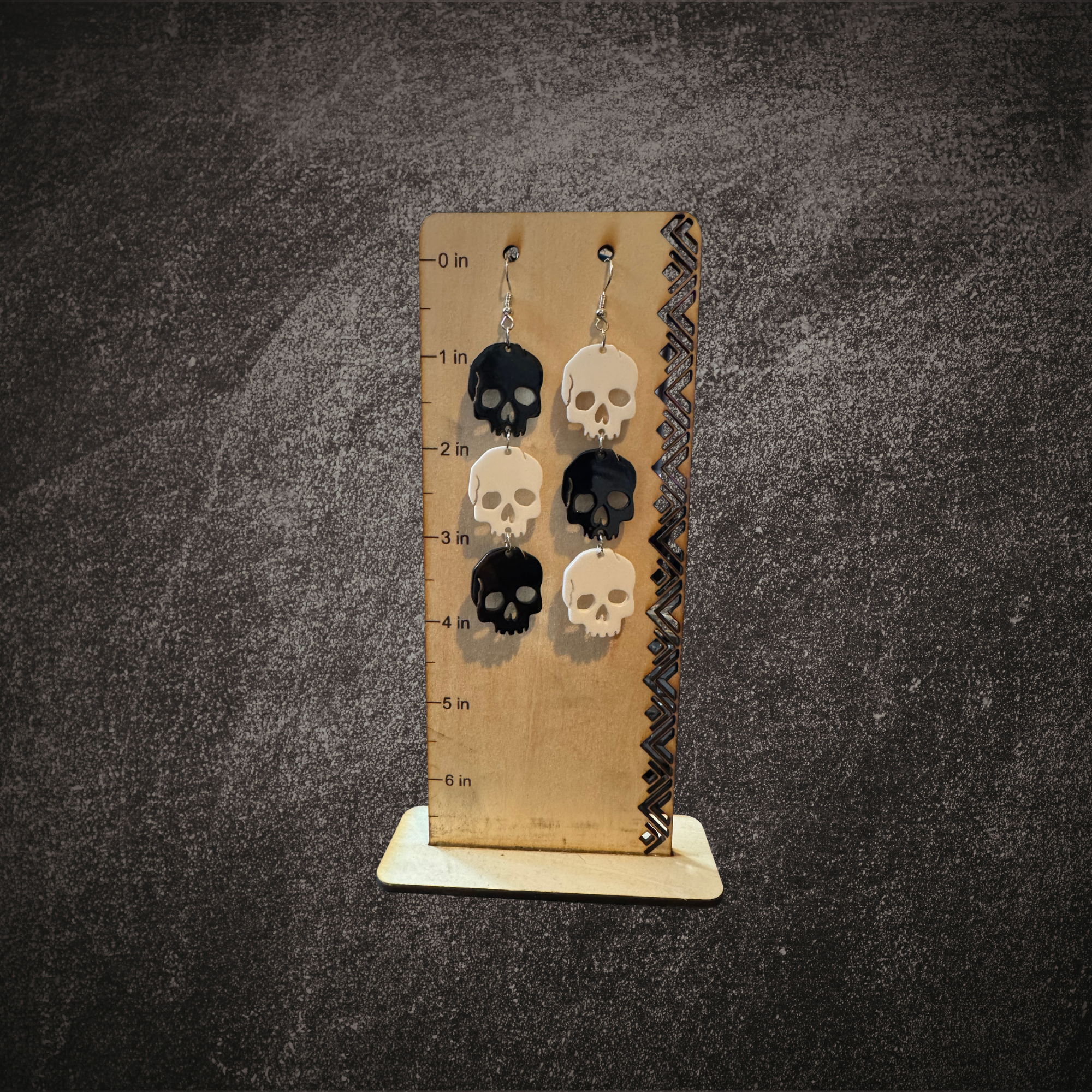 Black and White Skull Dangle Earrings Mockup 2.png