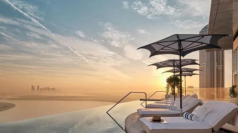 the-lana-dorchester-collection-high-society-pool-view-sunrise.jpg