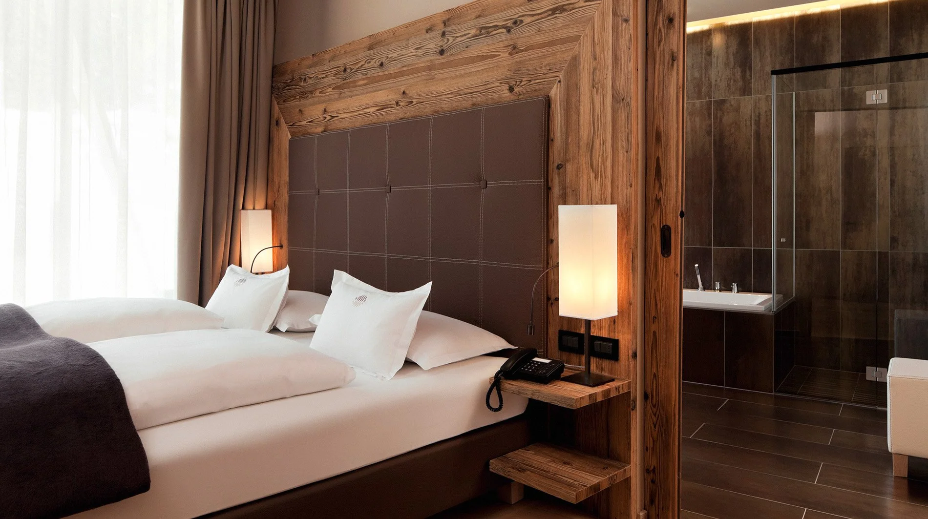 alpina-dolomites-suite-bedroom-and-bathroom.jpg