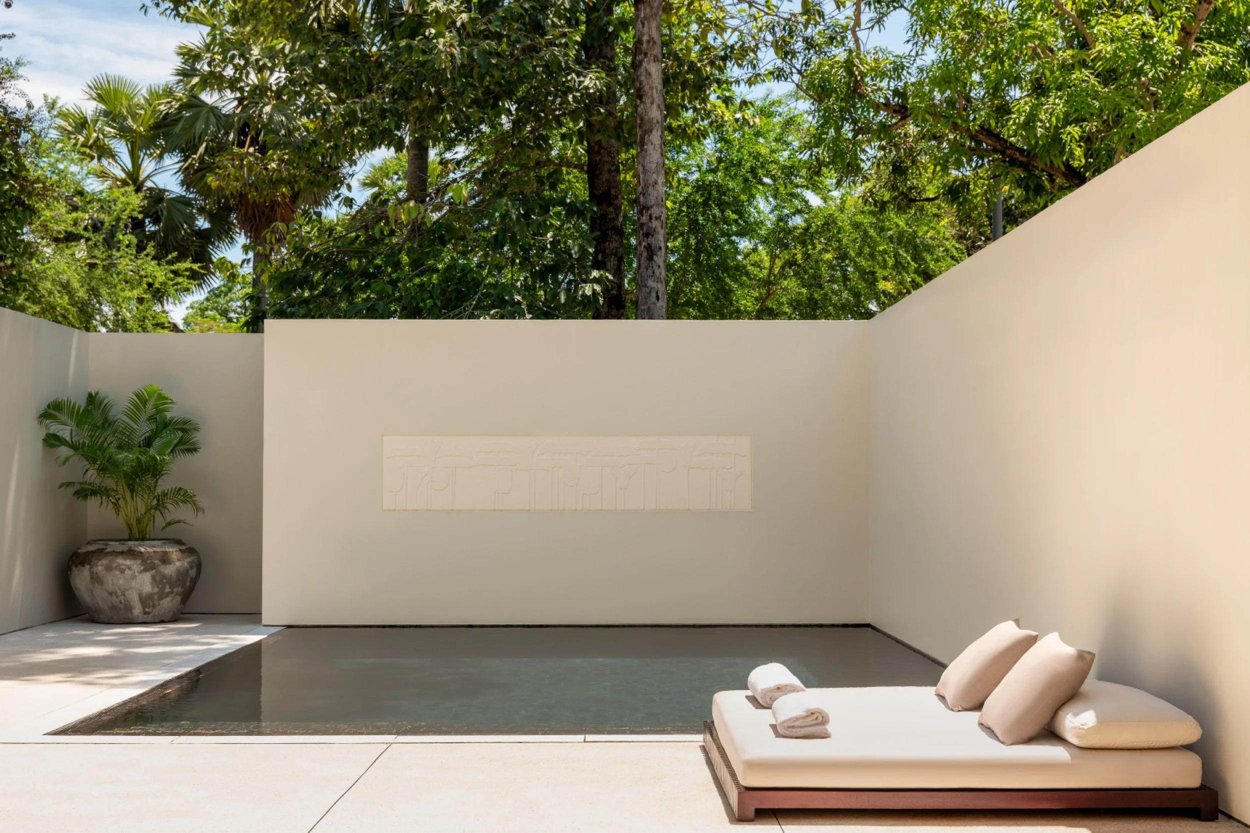 17-private-pool-courtyard-with-lounge-seating-and-garden-walls.jpg