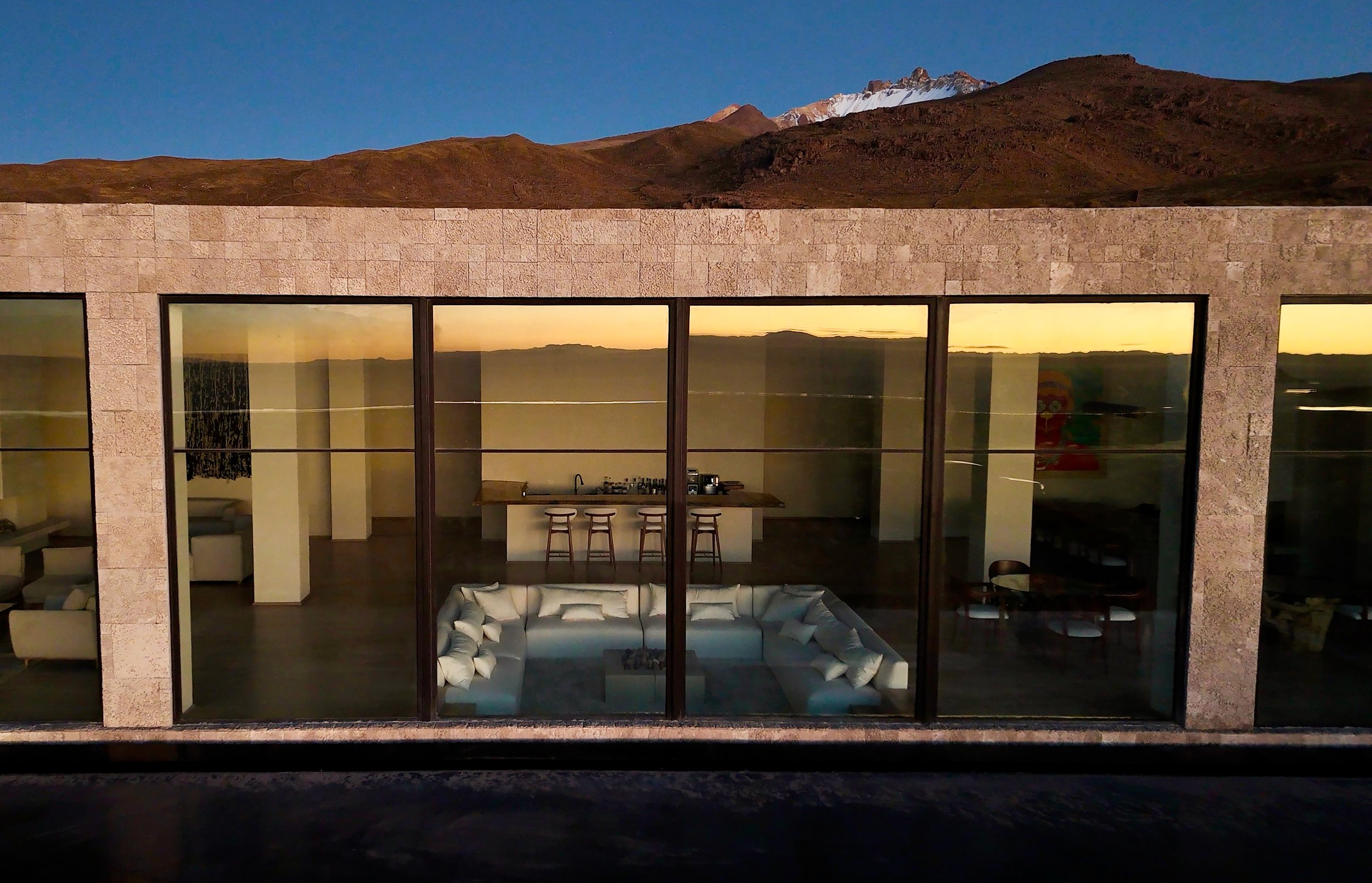 03-glazed-facade-reflecting-the-salar-at-dusk.jpg