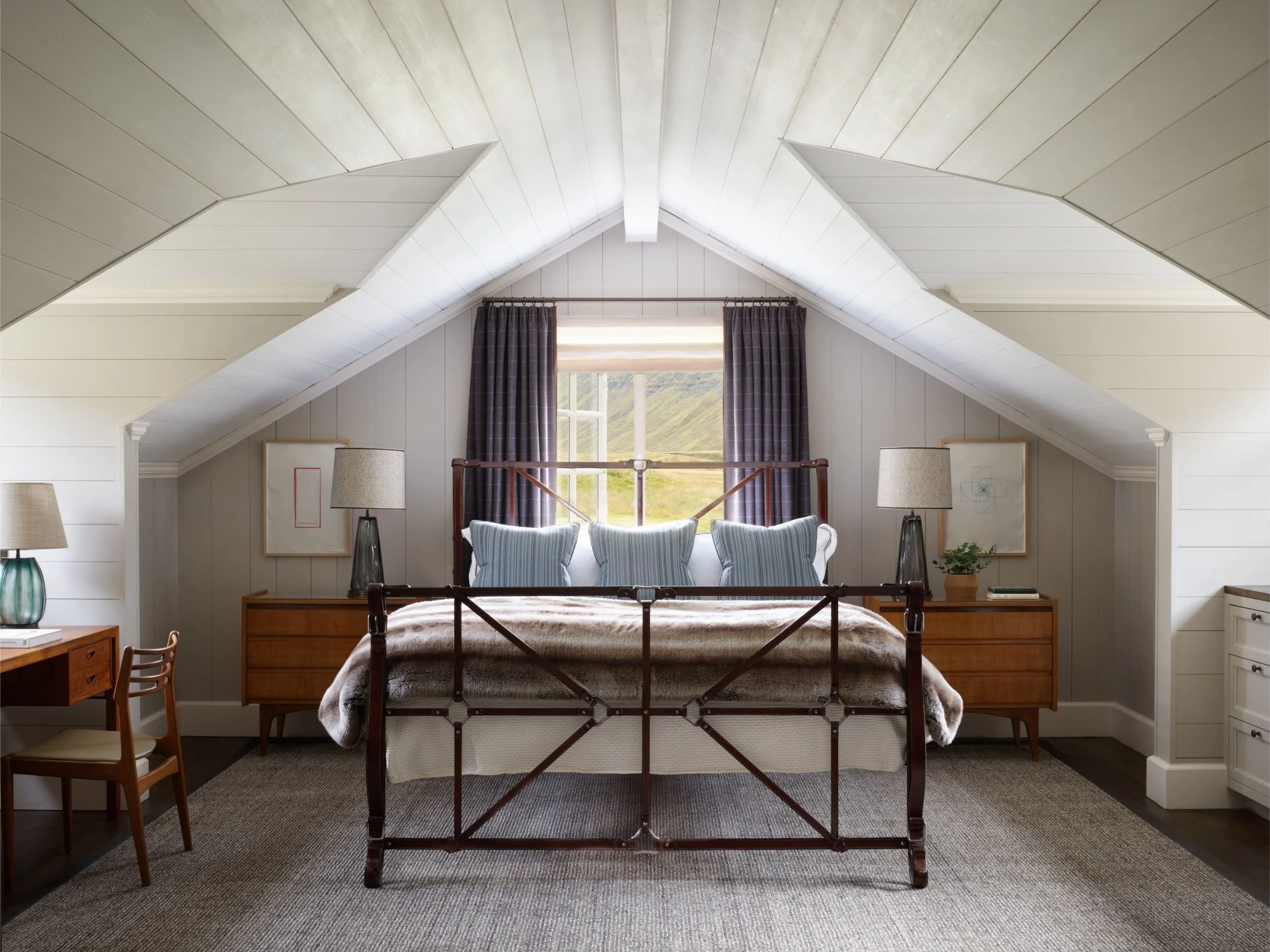 08-bedroom-beneath-a-vaulted-ceiling.jpg